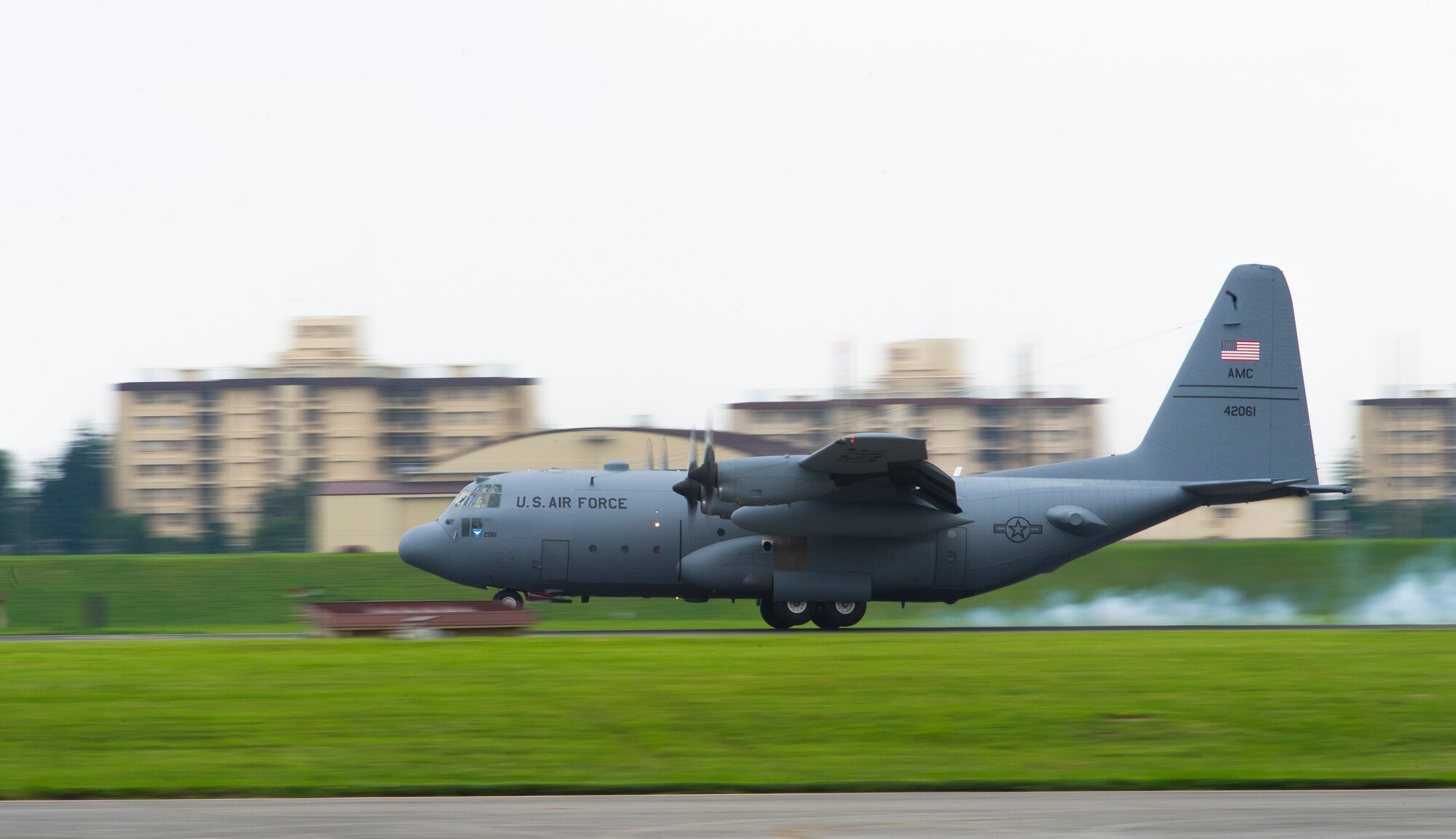 YOKOTA AIR BASE, Japan -- Col. Bill Knight, 374th Airlift Wing commander, lands a C-130 Hercules after completing his "fini-flight" at Yokota Air Base, Japan, June 25, 2012. (U.S. Air Force photo by Staff Sgt. Chad C. Strohmeyer)