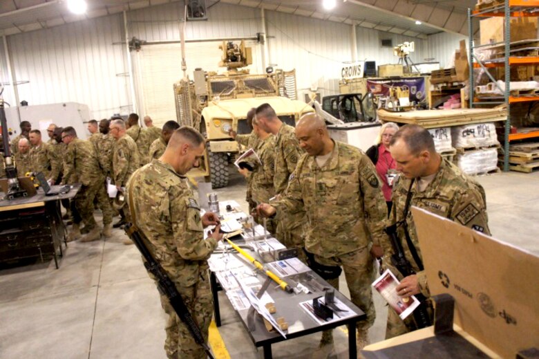BAGRAM AIRFIELD, Afghanistan — U.S. Army Research, Development and Engineering Command Field Assistance in Science and Technology-Center, or RFAST-C, engineers and technicians discuss prototype integration facility capabilities with senior noncommissioned officers from the 18th Engineer Brigade here, June 21, 2012.