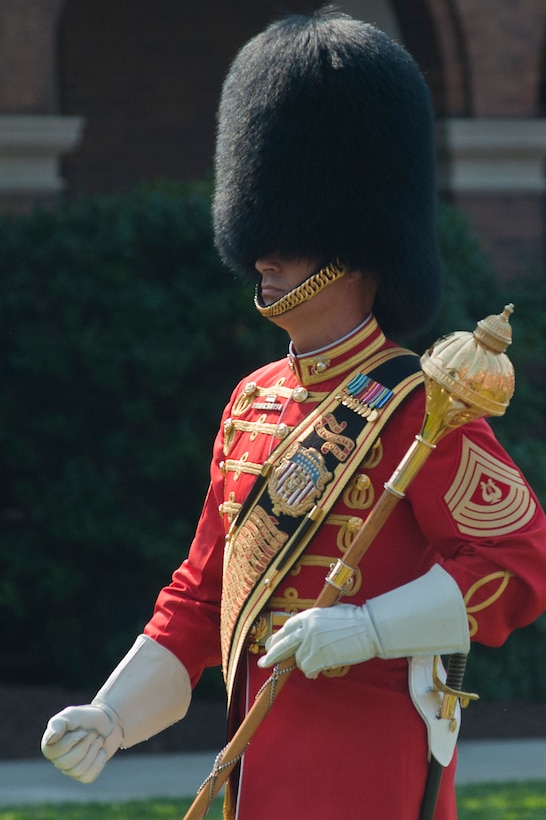 Master Gunnery Sgt. William L. Brown, U.S. Marine Band drum major, directs the band during a Congressional Gold Medal ceremony for Montford Point Marines at Marine Barracks Washington June 28. In 1942, President Roosevelt established a presidential directive giving African Americans an opportunity to be recruited into the Marine Corps. Between 1942 and 1949 approximately 20,000 African American Marines received basic training at the segregated Montford Point instead of the traditional boot camps of Parris Island, S.C. and San Diego, Calif. These men fought for their country with honor and valor that are hallmarks of the Corps, but they were not treated as equals to their white counterparts at the time. Gen. James F. Amos, commandant of the Marine Corps, set out to begin to right this wrong when he invited the Montford Point Marines to the Barracks Aug. 26, 2011 to be the guests of honor at a Friday Evening Parade, bringing their story to the national forefront and starting a chain of events that lead to this historic day.
