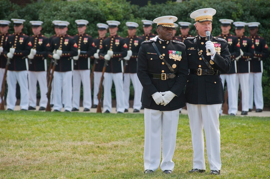 Gen. James F. Amos, commandant of the Marine Corps, publicly thanks and congratulates Lt. Gen. Willie Williams, director, Marine Corps staff and currently the senior African-American Marine in the Corps, during a Congressional Gold Medal ceremony at Marine Barracks Washington June 28. In 1942, President Roosevelt established a presidential directive giving African Americans an opportunity to be recruited into the Marine Corps. Between 1942 and 1949 approximately 20,000 African American Marines received basic training at the segregated Montford Point instead of the traditional boot camps of Parris Island, S.C. and San Diego, Calif. These men fought for their country with honor and valor that are hallmarks of the Corps, but they were not treated as equals to their white counterparts at the time. Gen. James F. Amos, commandant of the Marine Corps, set out to begin to right this wrong when he invited the Montford Point Marines to the Barracks Aug. 26, 2011 to be the guests of honor at a Friday Evening Parade, bringing their story to the national forefront and starting a chain of events that lead to this historic day.