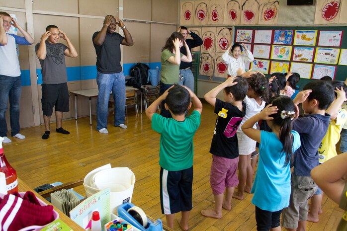 Marines and sailors from Marine Corps Air Station Iwakuni visit Kuroiso Hoikuen, a kindergarten in Iwakuni, June 26, 2012. The willingness of Marines and sailors to interact with the local community helps to maintain good relations between the Japanese community and servicemembers aboard the station.