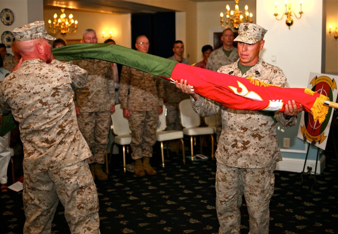 Maj. Gen. W. Lee Miller, Jr., Marine Air Ground Task Force - 13 commander and Sgt. Maj. Paul A. Berry, MAGTF-13 sergeant major uncase the colors at the activation ceremony for MAGTF-13, held aboard Marine Corps Base Camp Lejeune, June 29. MAGTF-13 is scheduled to deploy to southern Afghanistan and assume operational control of Regional Command Southwest in early 2013.