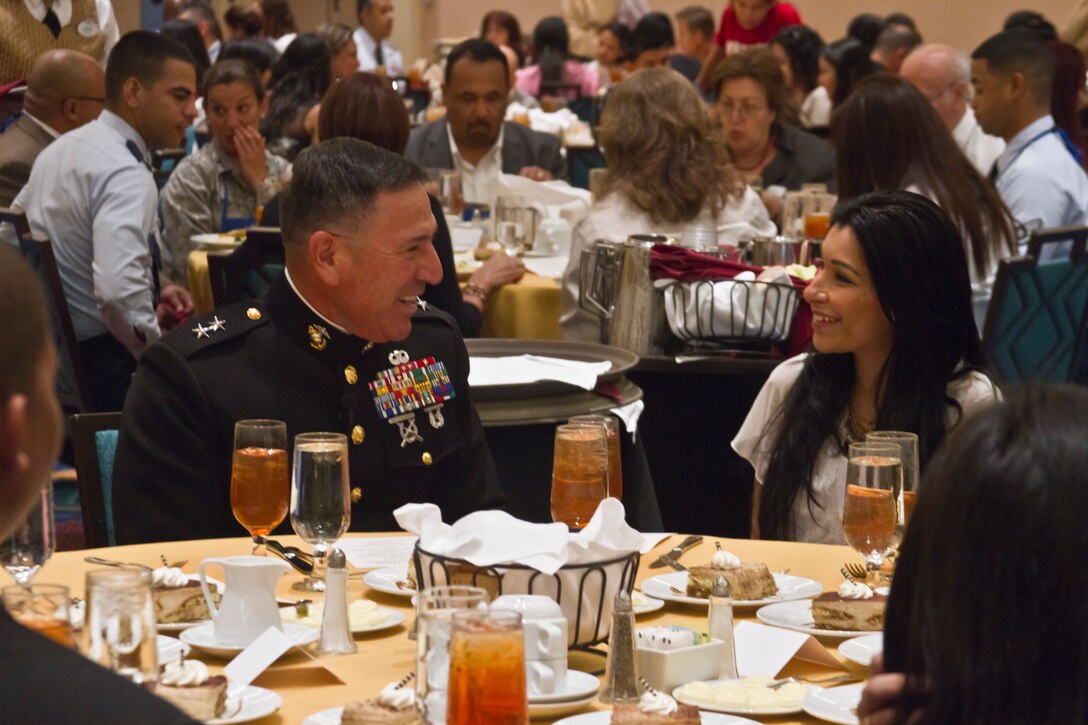 Major Gen. David C. Garza, inspector general of the Marine Corps, speaks to a student at the Department of Defense Collegiate Youth Luncheon Forum,  June 29. During the luncheon, which was part of the League of United Latin American Citizens’ annual convention, Marines spread themselves out to share a meal and their experiences and the Corps’ message of opportunity with hundreds of local high school and college students.