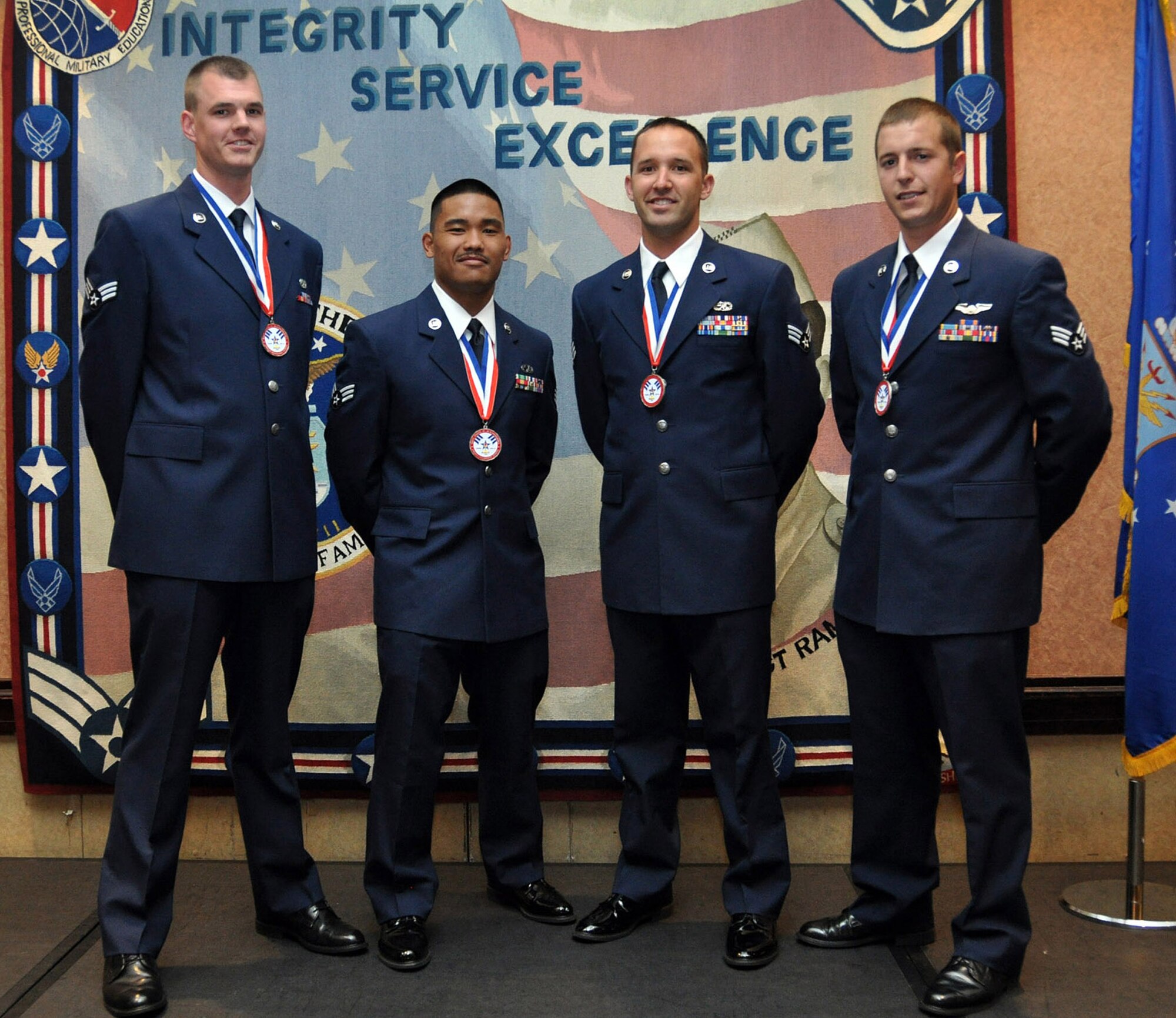 TRAVIS AIR FORCE BASE, Calif. -- Four Airmen from the 349th Air Mobility Wing graduated from the Airman Leadership School June 28, 2012, here. Pictured, from the left: Senior Airmen Daniel Butler, 749th Aircraft Maintenance Squadron, Glenn Acuna, 45th Aerial Port Squadron, Kyle Meyerdick, 945th AMXS and Shane Nichols, 312th Airlift Squadron. (U.S. Air Force photo/Tech. Sgt. Rachel Martinez)