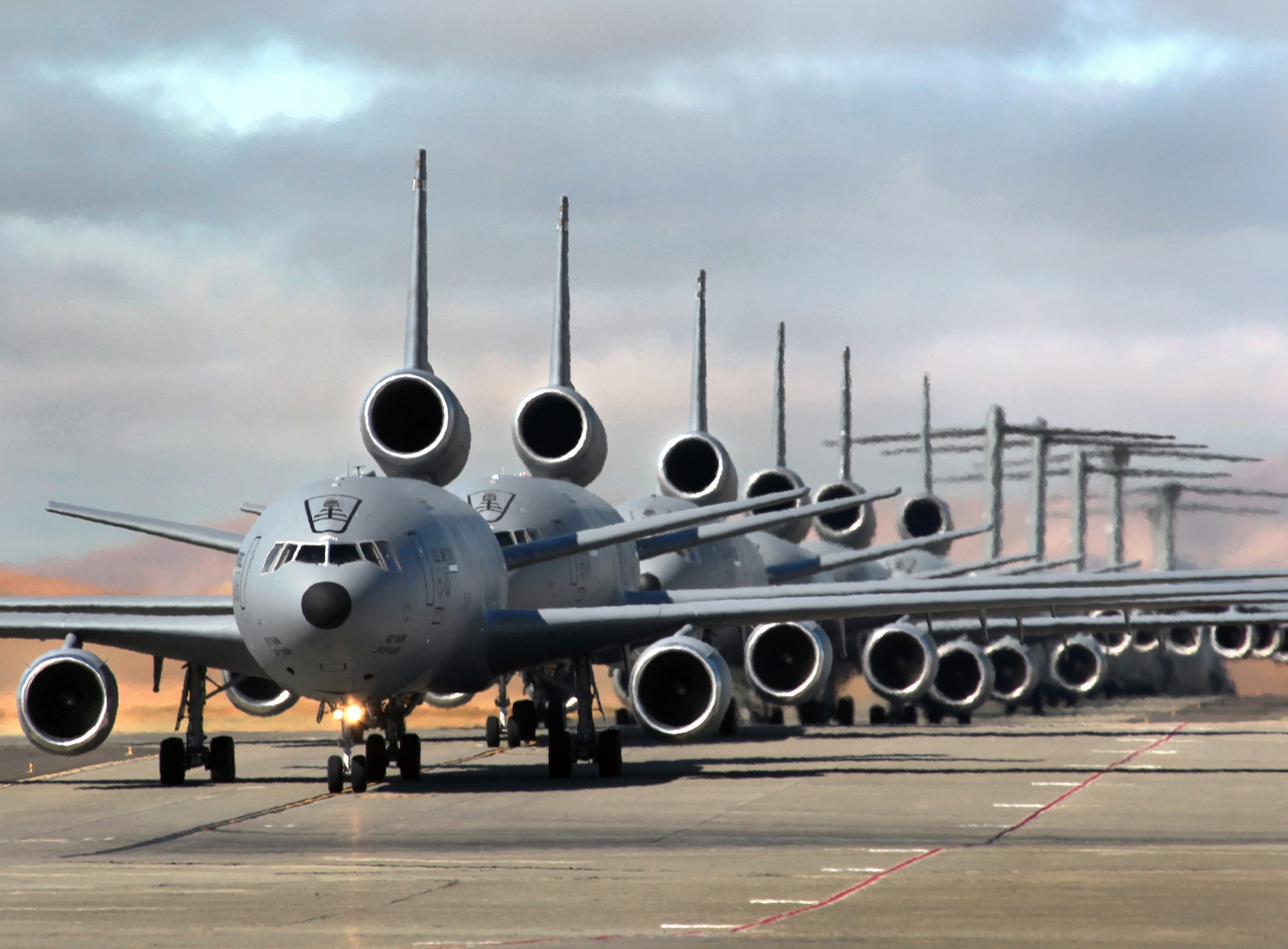 Team Travis conducts a mass launch of 12 mobility aircraft June 29, 2012, practicing the combat capability of safely and swiftly launching a large number of aircraft in an "elephant walk." (U.S. Air Force photo / Lt. Col. Robert Couse-Baker)