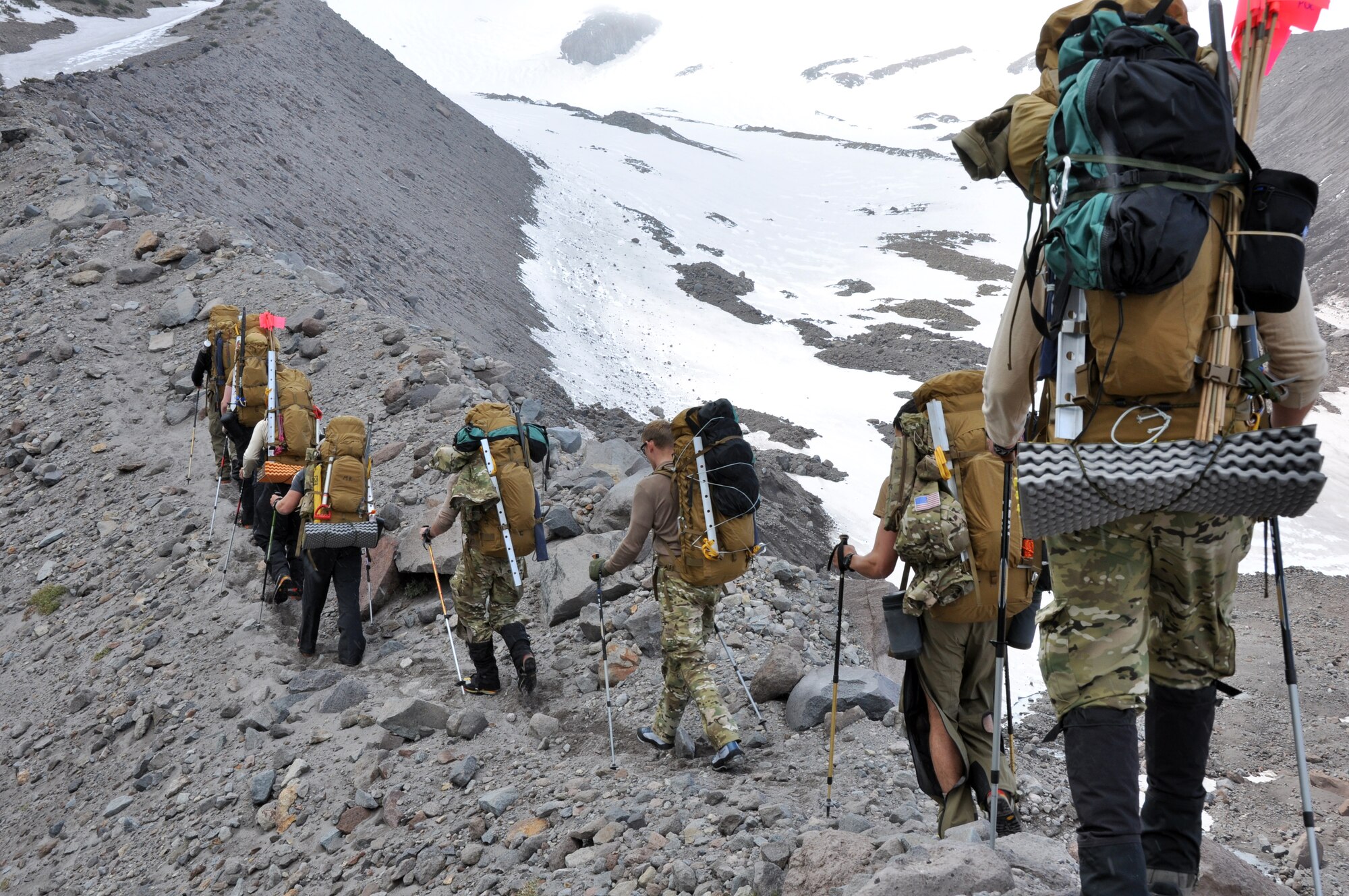 Pararescuemen from the 304th Rescue Squadron hike along a ridge on Mount Hood, Ore., June 26, 2012, at an altitude of approximately 6,400 feet. The hike was part of a weeklong mountain survival and search-and-rescue training with instruction from 304th RQS senior noncommissioned officers.  (U.S. Air Force photo/Staff Sgt. Anna-Marie Wyant)