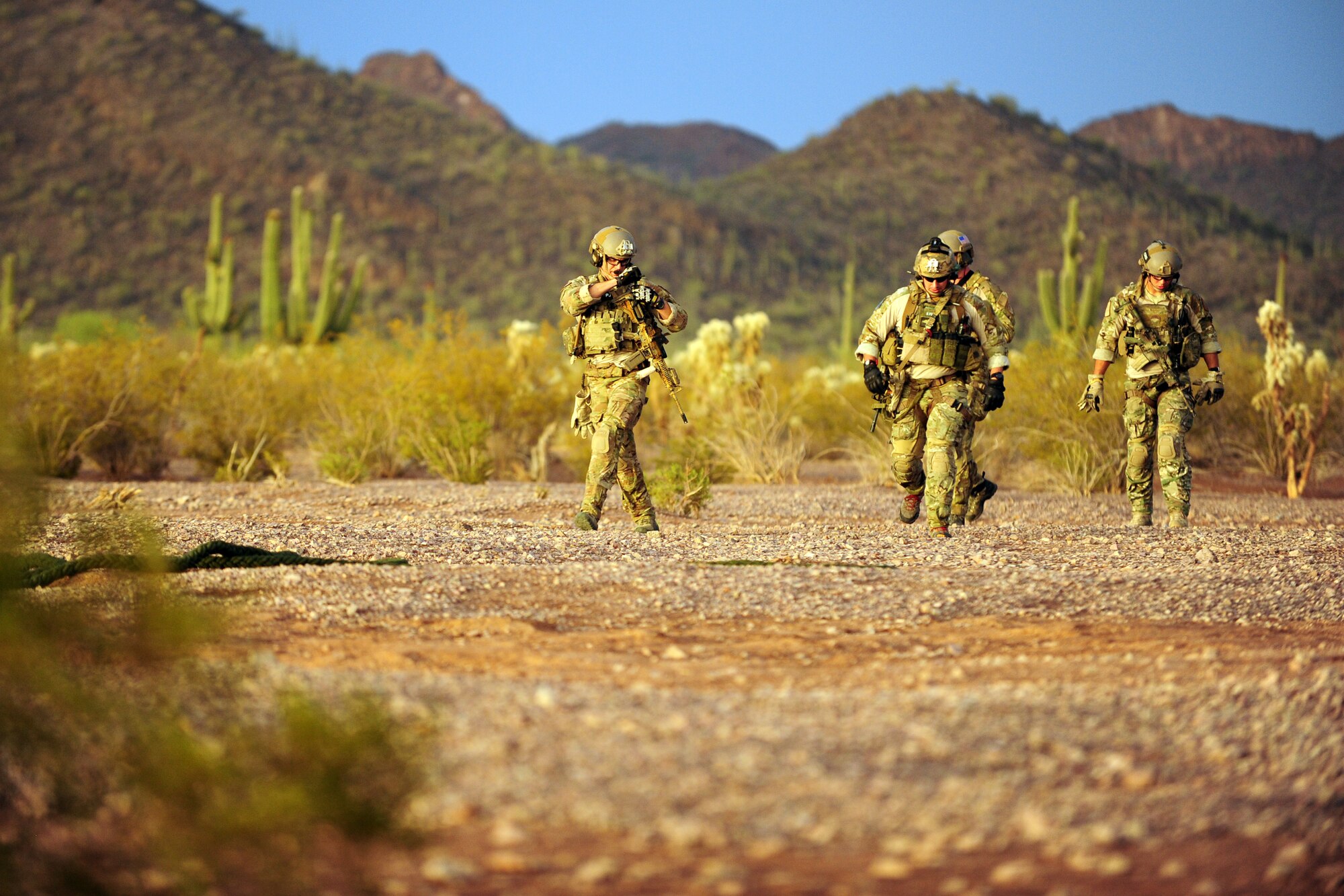 U.S. Air Force pararescueman from the 48th Rescue Squadron asses their location during a training flight in Tucson, Ariz., June 27, 2012. Part of the training was to ascend into a helicopter by rope ladder and hoist. (U.S. Air Force photo by Airman 1st Class Camilla A Griffin/Released)