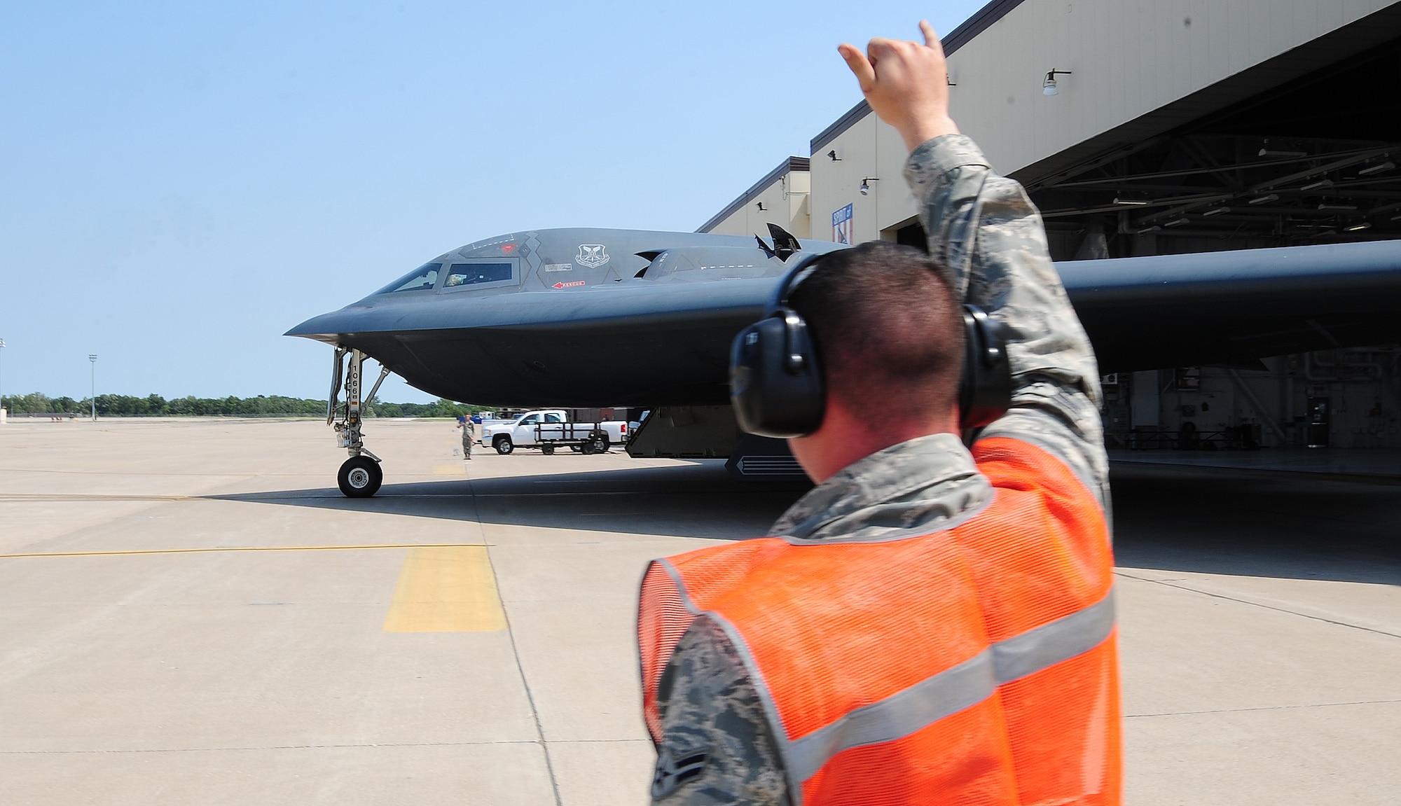WHITEMAN AIR FORCE BASE, Mo. -- Airman 1st Class Eljay Noel, 13th Aircraft Maintenance Unit B-2 Spirit crew chief, marshalls a B-2 Spirit from the 509th Bomb Wing prior to its departure to Smoky Hill Air National Guard Range in Salina, Kan., to participate in Global Strike Challenge 2012 June 26. The goals of the competition include recognizing superior performers, enhancing esprit de corps while strengthening teamwork and improving readiness and combat capabilities through preparation, innovation, competition and teamwork. (U.S. Air Force photo/Senior Airman Nick Wilson) (Released)