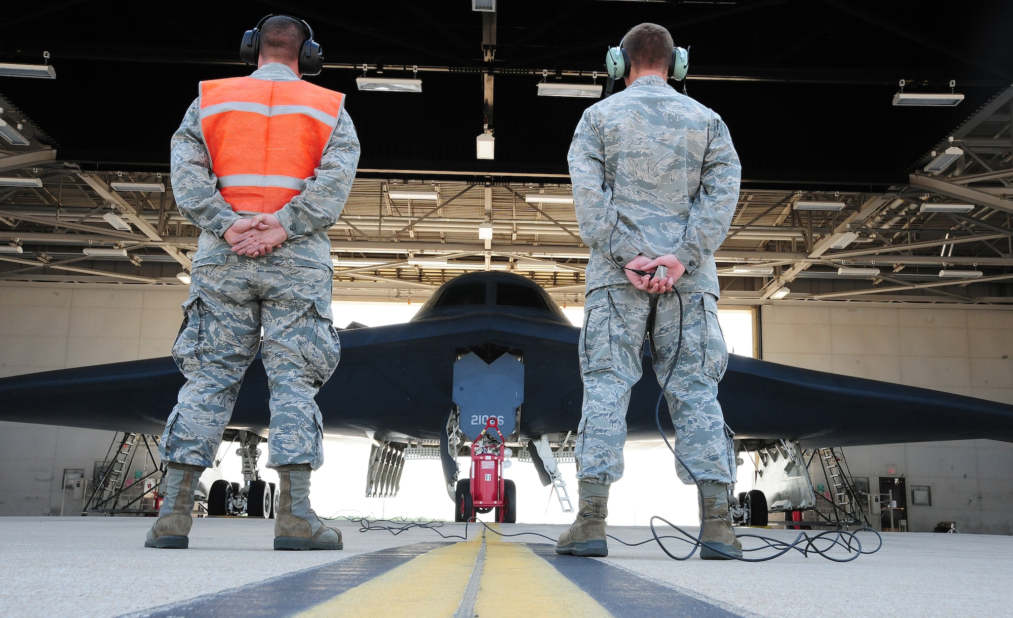 WHITEMAN AIR FORCE BASE, Mo. -- Airman 1st Class Eljay Noel and Airman 1st Class Jimmy Womack, B-2 Spirit crew chiefs from the 13th Aircraft Maintenance Unit, perform preflight checks on a B-2 Spirit from the 509th Bomb Wing prior to its departure to Smoky Hill Air National Guard Range in Salina, Kan., to participate in Global Strike Challenge 2012 June 26. One of the main components of the competition judged is how accurate munitions are when pilots hit their targets. Points are deducted per foot that the particular bomb lands from its target. (U.S. Air Force photo/Senior Airman Nick Wilson)