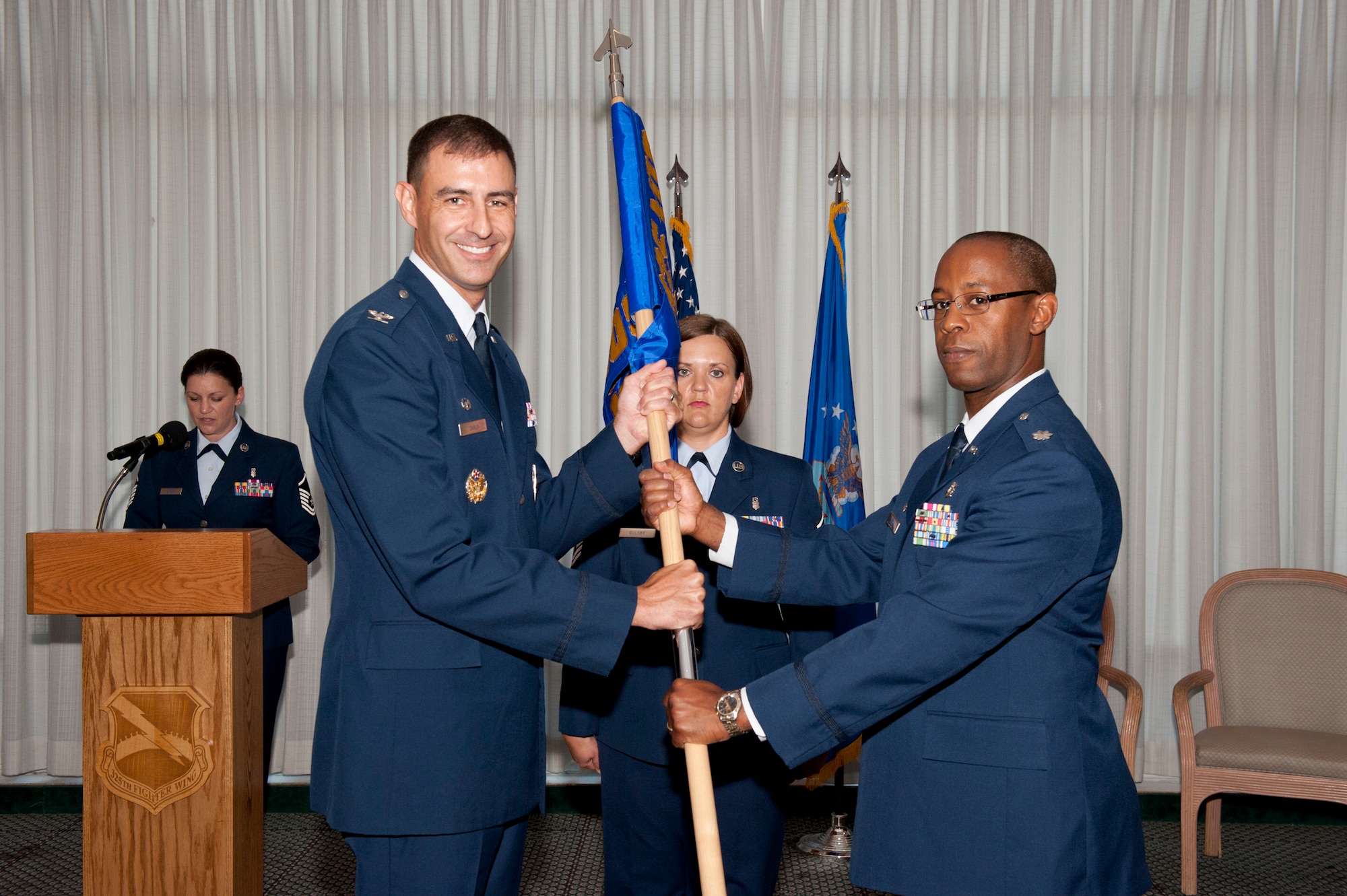 Col. Paul Skala, 325th Medical Group commander, passes command of the 325th Medical Operations Squadron to Lt. Col. Lionel Lyde during a change of command ceremony June 29. Lyde assumes command of the 325th MDOS from Lt. Col. Kevin Poitinger. He arrived at Tyndall from Joint Base Langley-Eustis, Va., where he served in the 633rd Medical Group as the multi-service flight commander. (U.S. Air Force photo by Lisa Norman)
