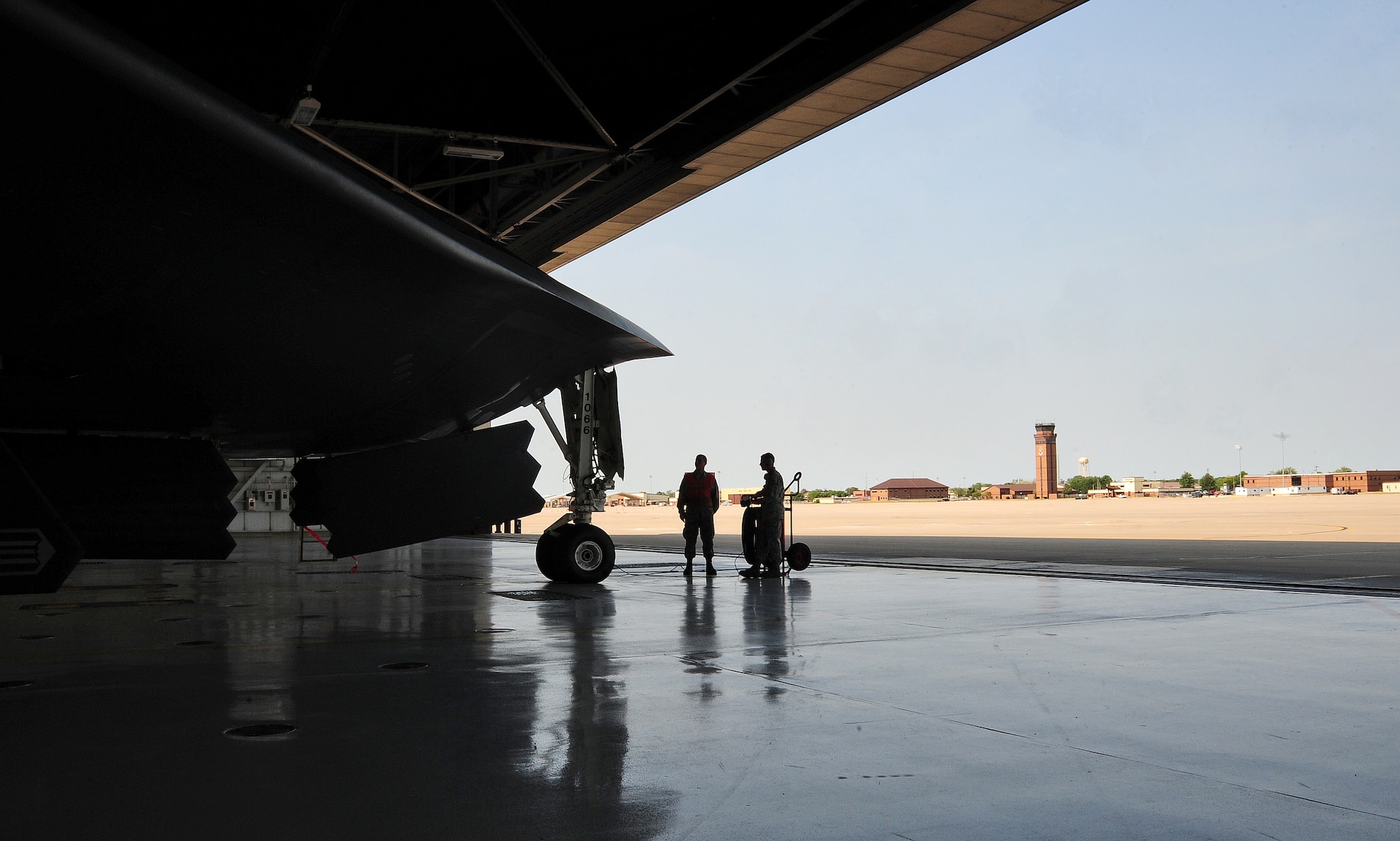 WHITEMAN AIR FORCE BASE, Mo. -- Airman 1st Class Eljay Noel, 13th Aircraft Maintenance Unit B-2 Spirit crew chief, and Airman 1st Class Jimmy Womack, 13th AMU B-2 crew chief, perform preflight checks on a B-2 from the 509th Bomb Wing prior to its departure to Smoky Hill Air National Guard Range in Salina, Kan., to participate in Global Strike Challenge 2012, June 26. The Global Strike Challenge allows Airmen an opportunity to participate in innovative thinking, teamwork and esprit de corps that are central to the Air Force Global Strike Command mission. (U.S. Air Force photo/Senior Airman Nick Wilson) (Released)  
