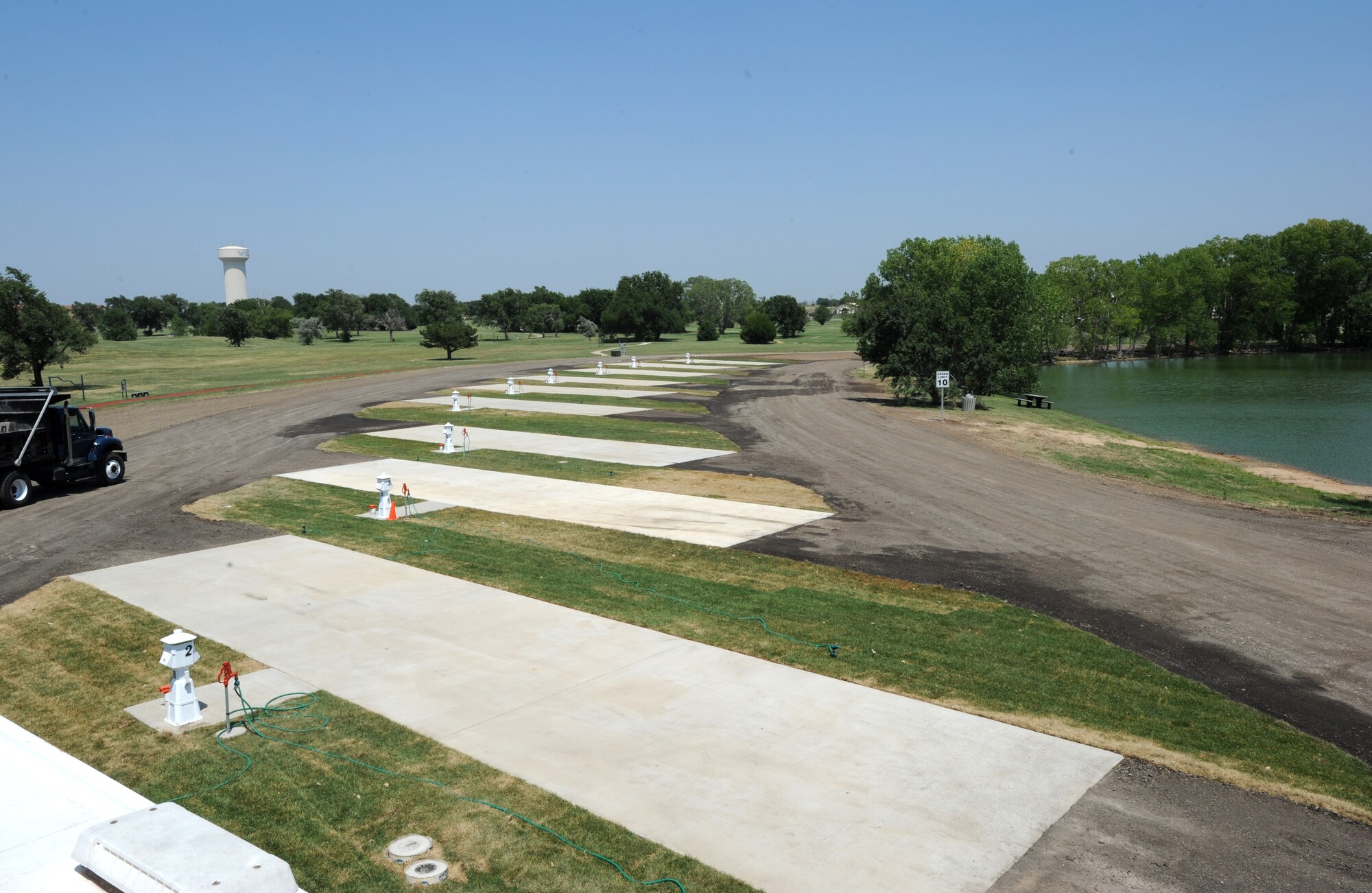 McConnell's Family Camp now offers recreational vehicle and camper customers ten newly paved, pull-through slots with full hook-ups June 28, 2012, McConnell Air Force Base, Kan. The slots are adjacent to fishing ponds, a playground, a covered picnic area and restrooms. (U.S. Air Force photo/ Airman 1st Class Laura L. Valentine)