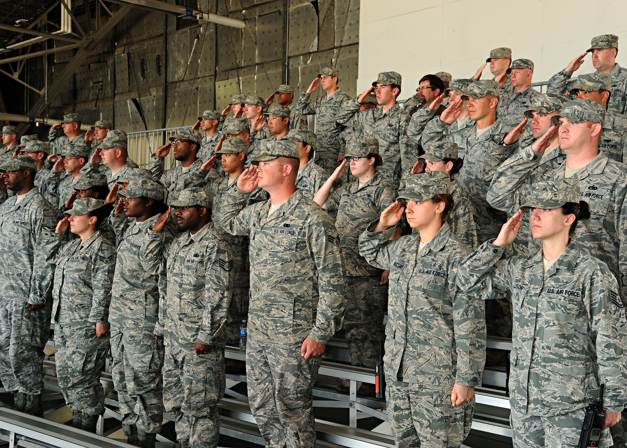 Members of the 319th Air Base Wing give a final salute to Maj. Reynaldo Gonzalez, 319th Logistics Readiness Squadron commander, during a change of command, June 27, 2012, on Grand Forks Air Force Base, N.D.  Gonzalez relinquished over command to Maj. Johari Hemphill (U.S. Air Force photo by Senior Airman Amber Bennett)