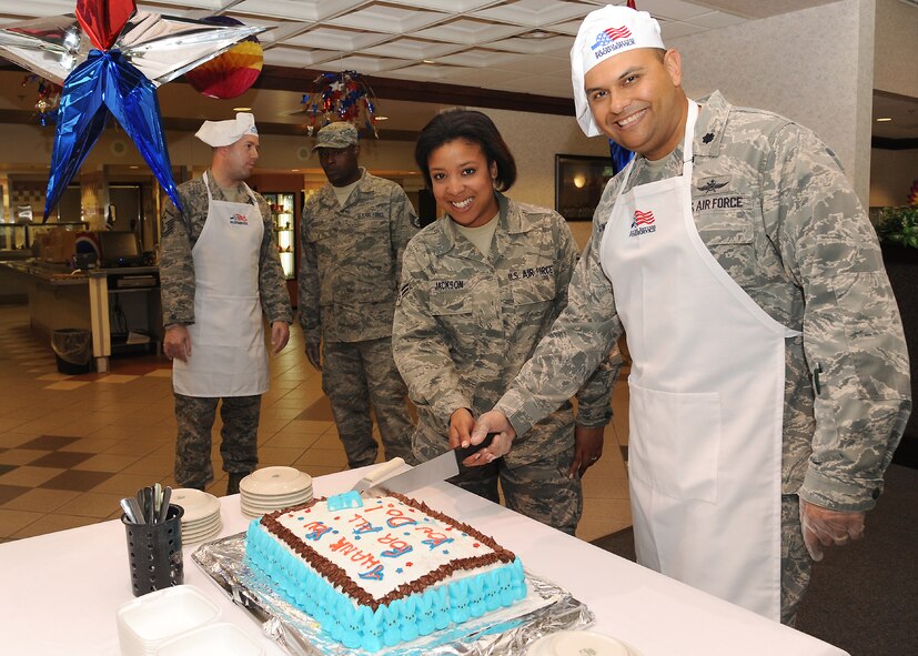 Lt. Col. Franciso Gonzalez Jr., 319th Communications Squadron commander, and Airman 1st Class Kristen Jackson, 319th Logistics Readiness Squadron, cut the cake during an Airmen Appreciation Dinner on June 27, 2012, on Grand Forks Air Force Base, N.D.  The dinner was held at the Airey Dining Facility by 319th Air Base Wing leadership to thank Airmen for all they do. (U.S. Air Force photo by Airman 1st Class Xavier Navarro)