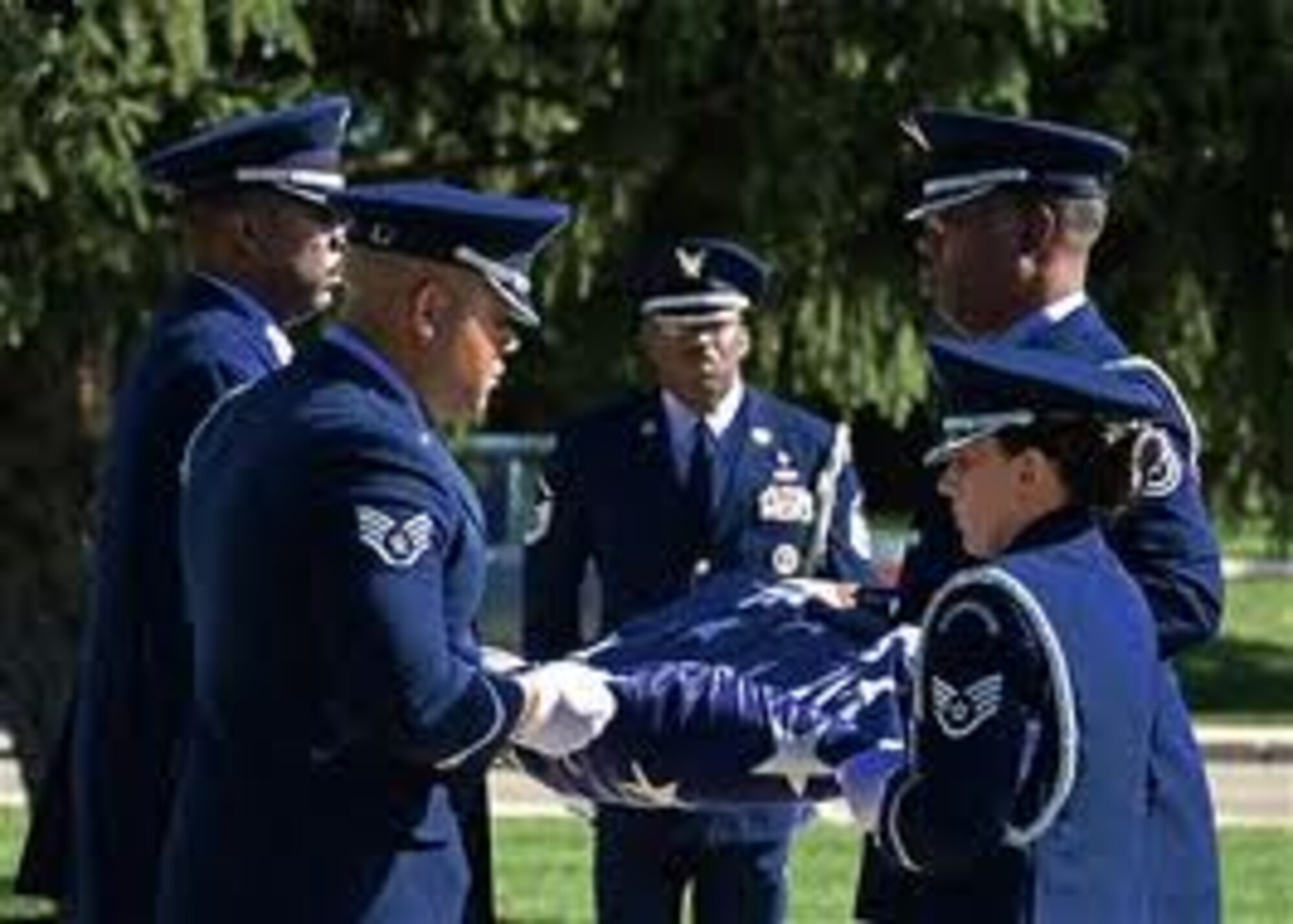 Master Sgt. Mark Lyle (center) and his team performing the 88th Air Base Wing monthly retreat ceremony. This ceremony is held as a reminder of the importance of our flag, and in honor of all Airmen serving in the U.S. and abroad. (Courtesy Photo)