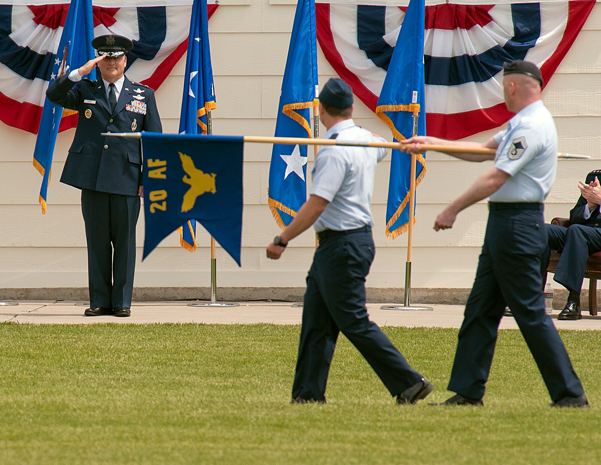 Maj. Gen. Michael J. Carey, 20th Air Force commander, saluted members of the 20th AF flight during the pass and review portion of the 20th AF and Task Force 214 change-of-command ceremony June 22 on the Historic Argonne Parade Field at F.E. Warren Air Force Base, Wyo. (U.S. Air Force photo/R.J. Oriez)
