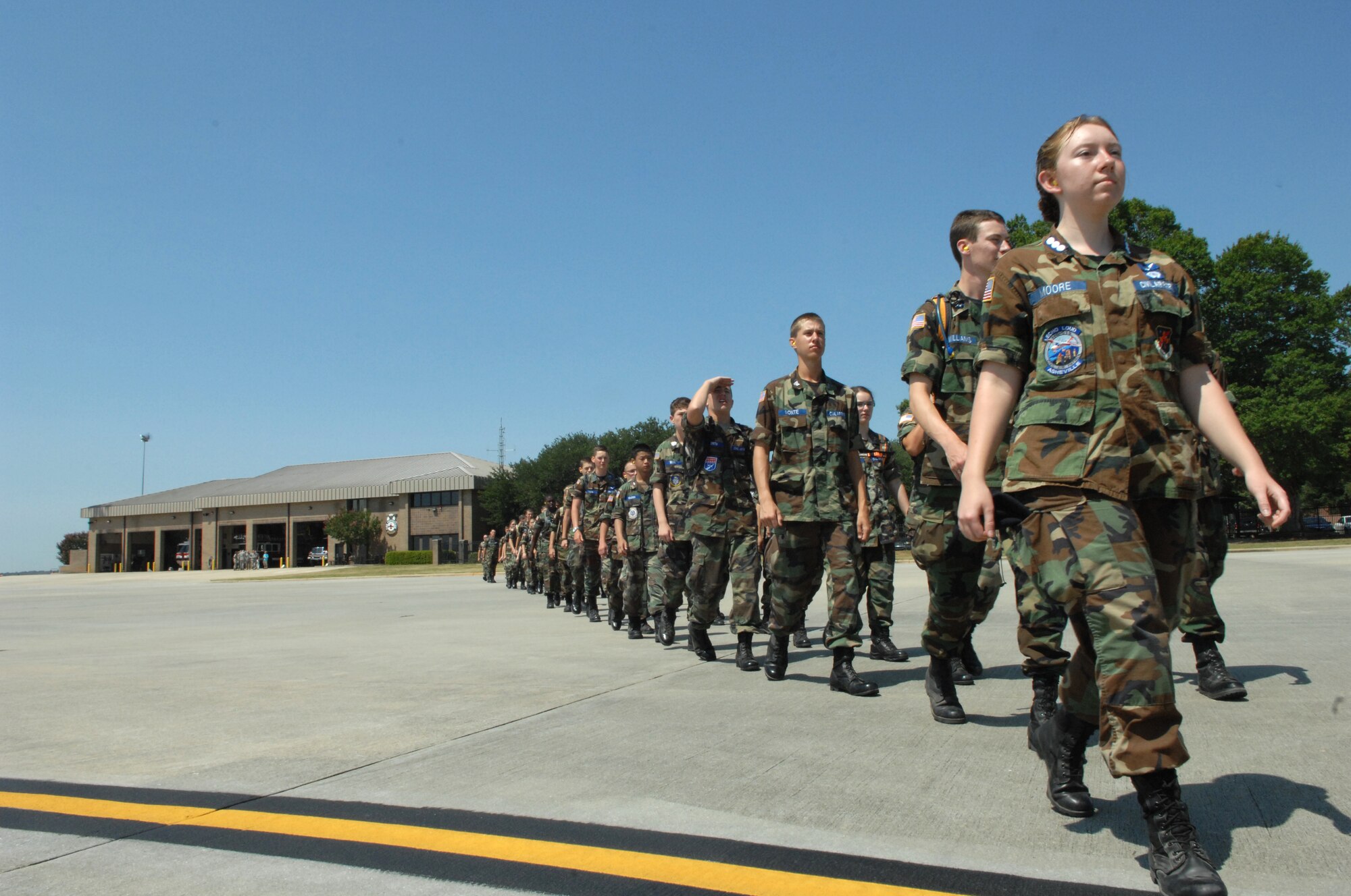 U.S. Civil Air Patrol cadets walk onto the flight line at Shaw Air Force Base, S.C., June 28, 2012.  The cadets visited Shaw and toured the Shaw Fire Station and took a flight on a C-17.(U.S. Air Force Airman Nicole Sikorski/Released)
