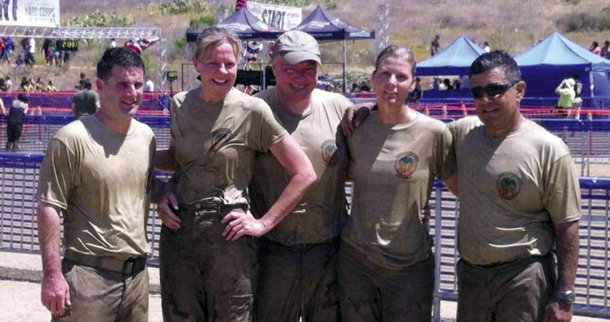 Team March members participated under the name of, “Team Sky Gods,” during the 2012 Hard Corps, Armed Services YMCA Mud Run at Camp Pendleton, Saturday, June 16. Team members (bottom photo), starting from left to right are Lt.Col. Brice Middleton, Lt. Col. Dawn Deshefy, Col. Mark Sigler, Tech. Sgt. Kelley Lundrigan and Lt. Col. Antonio Astran, shown in before and after photos. (Courtesy photo to U.S. Air Force)