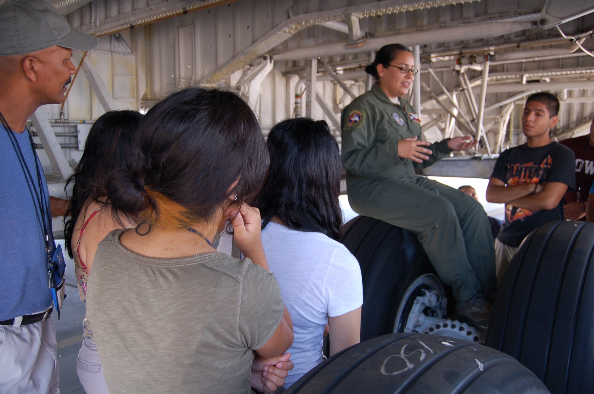 Airman First Class Jaqlynn De La Rosa, a 68th Airlift Squadron loadmaster, explains the C-5A Galaxy's landing gear to ACE Aviation Camp students June 28, 2012 at Joint Base San Antonio-Lackland, Texas.  The 68th AS is one of three flying squadrons attached to the 433rd Airlift Wing. The ACE program helps students develop an awareness of the role of aviation inhuman history, encourages exploration of career opportunities in aviation, introduces the role of government relating to aviation, and develops an understanding of socio-economic benefits of aviation in our communities and daily lives. 