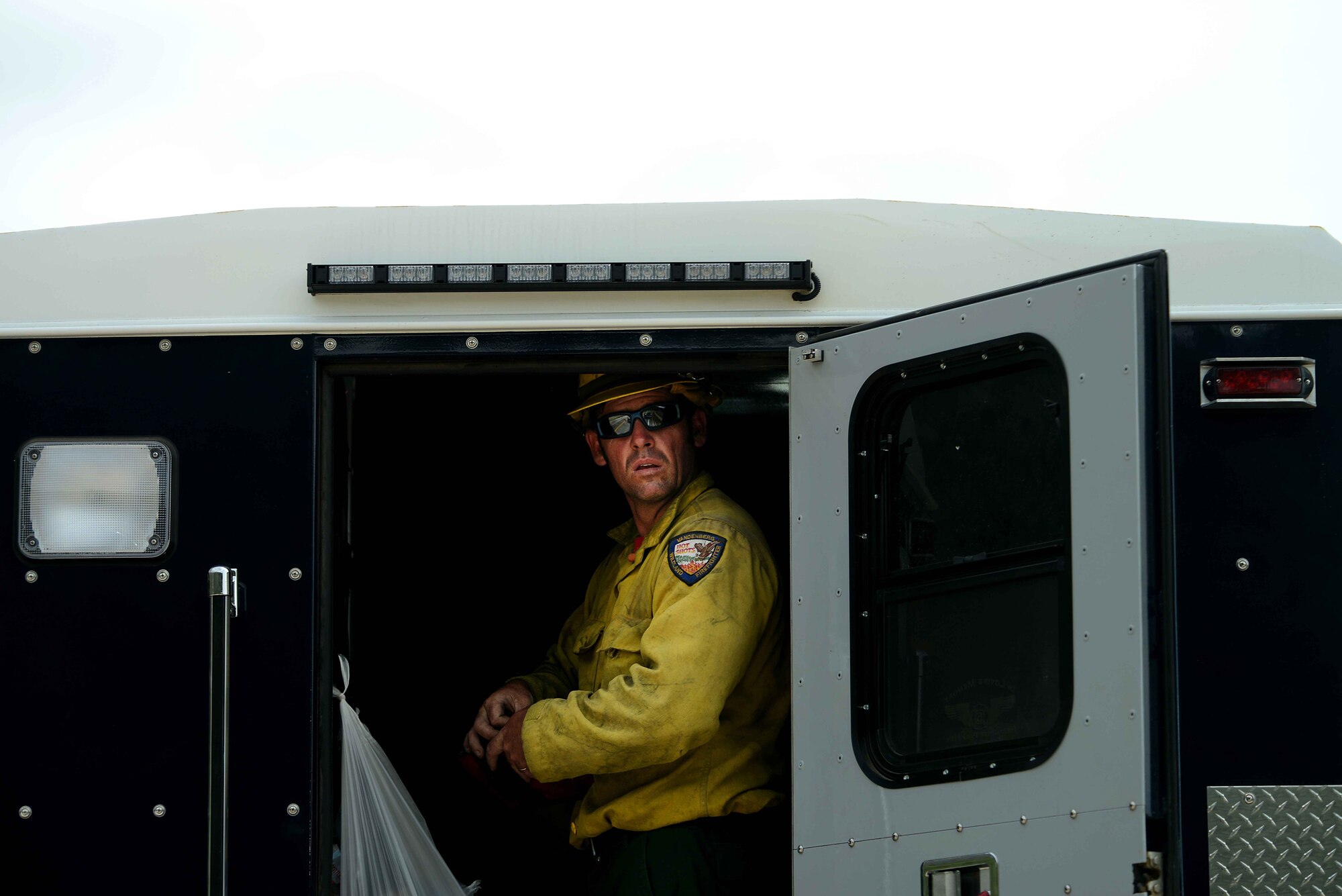 Nathan Ogan looks out at his worksite for the day in the Mount Saint Francois area of Colorado Springs, Colo., on June 28, 2012. Ogan and the rest of the firefighters of the Vandenberg Air Force Base, Calif., Hot Shots cut a fire line to help battle several fires in Waldo Canyon.  (U.S. Air Force photo/Master Sgt. Jeremy Lock)