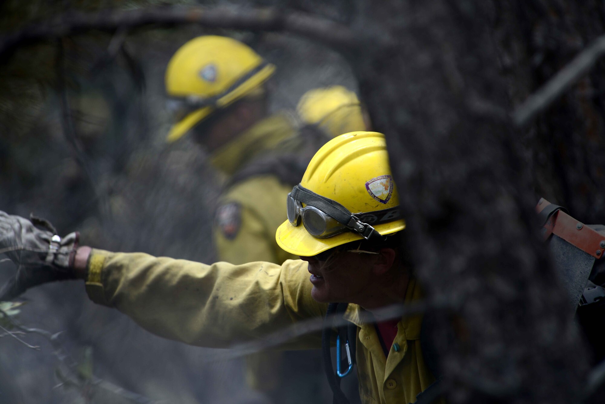 Marissa Halbeisen helps cut and clear a fire line in the Mount Saint Francois area of Colorado Springs, Colo., June 28, 2012.  Currently, more than 90 firefighters from the U.S. Air Force Academy, along with assets from Air Force Space Command; F.E. Warren Air Force Base, Wyo.; Fort Carson, Colo.; and the local community continue to fight the Waldo Canyon fire. Halbeisen is a firefighter with the Vandenberg Air Force Base, Calif., Hot Shots. (U.S. Air Force photo/Master Sgt. Jeremy Lock)