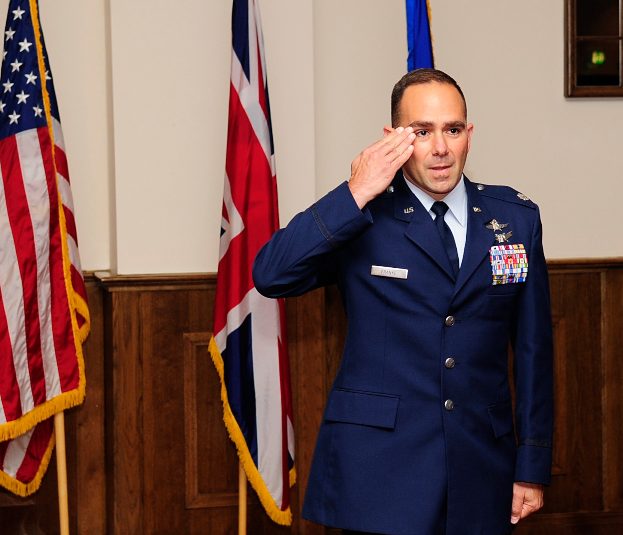 RAF MILDENHALL, England – The newly-appointed 100th Communications Squadron Commander, Lt. Col. Albert Franke, IV, salutes his squadron for the first time during the 100th CS change of command ceremony June 29, 2012, at the Galaxy Club. Franke comes to Team Mildenhall from Headquarters U.S. Air Forces in Europe, Ramstein Air Base. (U.S. Air Force photo/Senior Airman Ethan Morgan) 