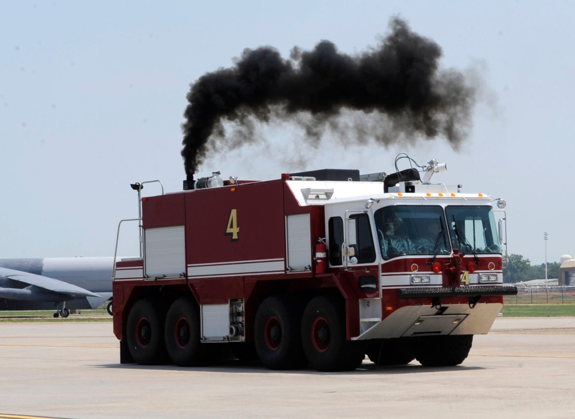 A 2nd Civil Engineer Squadron fire truck approaches an aircraft parking area during a Nuclear Surety Exercise on Barksdale Air Force Base, La., June 26. The base firefighters exercised their response to a simulated fire with possible strategic assets present. The NSE ensures firefighters are prepared to accomplish the mission in the presence of strategic assets. (U.S. Air Force photo/Airman 1st Class Joseph A. Pagán Jr.)(RELEASED) 