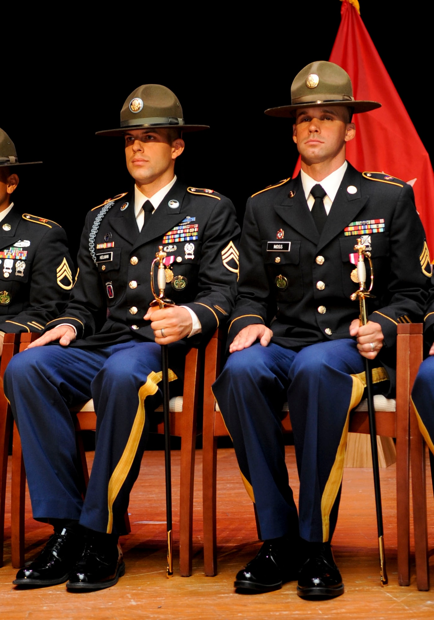 (From left) U.S. Army Staff Sgt. Jeffrey Heilman, a drill sergeant assigned to Fort Jackson, S.C., and Staff. Sgt. Jarod Moss, assigned to the 95th Reserve Division at Fort Sill, Okla., sit with their non-commissioned officer swords after being named active-duty and reserve Drill Sergeants of the Year respectively, at the closing ceremony for the U.S. Army’s 2012 DSOY competition at Fort Eustis, Va., June 29, 2012. The drill sergeants earned top honors from battalion level up through installation level, and represent the best drill sergeants in the Army. (U.S. Air Force photo by Senior Airman Wesley Farnsworth/Released)