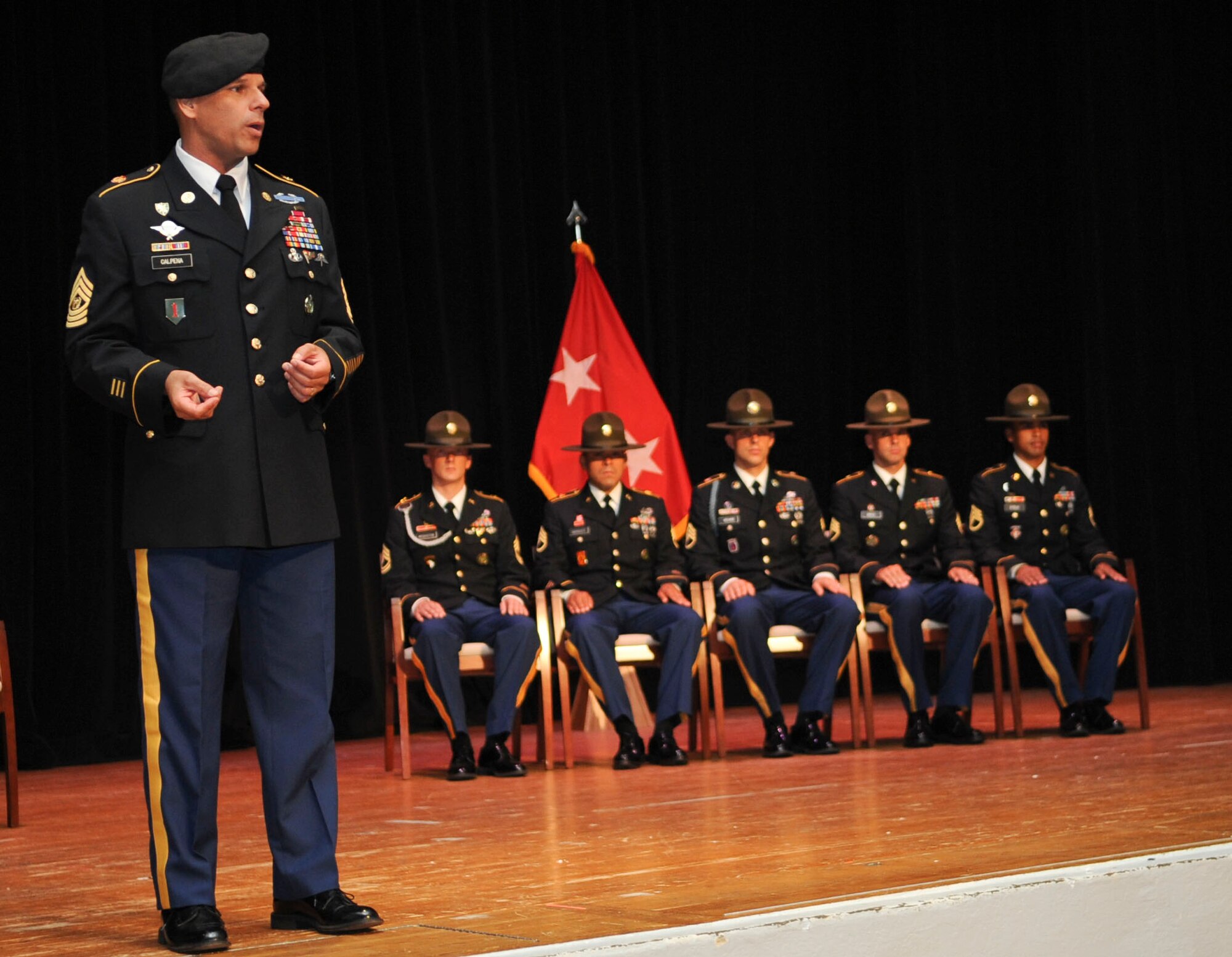 Command Sgt. Major John R. Calpena, Initial Military Training Center of Excellence command sergeant major, addresses the crowd at the U.S. Army’s 2012 Drill Sergeant of the Year competition at Fort Eustis, Va., June 29. 2012.  Staff Sgt. Jeffrey Heilman, a drill sergeant assigned to Fort Jackson, S.C., was named the active-duty DSOY, while Staff. Sgt. Jarod Moss, assigned to the 95th Reserve Division at Fort Sill, Okla., earned the title of Army Reserve DSOY. (U.S. Air Force photo by Senior Airman Wesley Farnsworth/ Released)