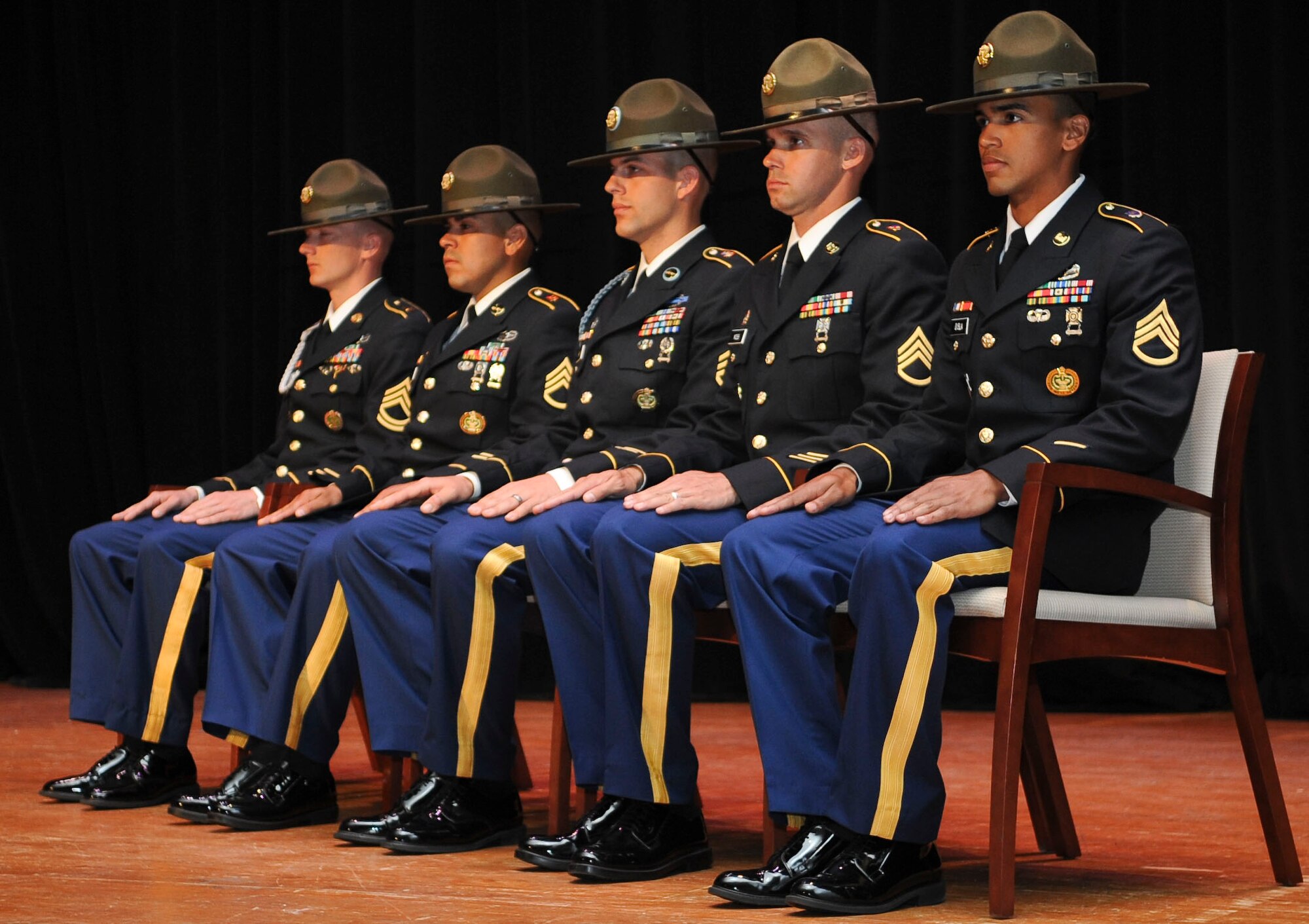 Participants of the U.S. Army’s 2012 Drill Sergeant of the Year competition await the results during the closing ceremony at Jacob’s Theater, Fort Eustis, Va., June 29, 2012. One active-duty and one reserve drill sergeant were awarded the title Drill Sergeant of the Year after a weeklong competition. (U.S. Air Force photo by Senior Airman Wesley Farnsworth/Released)