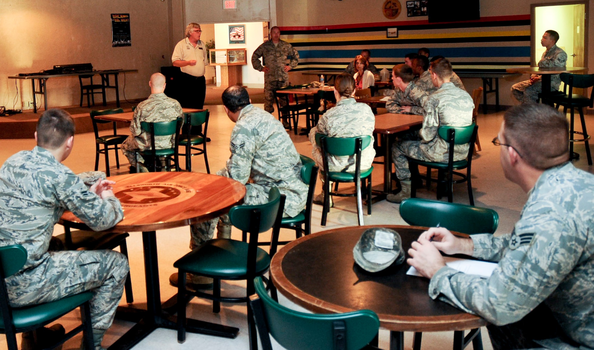 Airmen gather together to discuss ideas during a Single Airmen Program focus group at the Dakota’s Club on Ellsworth Air Force Base, S.D., June 27, 2012. Chief Master Sgt. Brian Lavoie, 28th Bomb Wing command chief, and Mr. Gale Thompson, 28th Force Support Squadron activities program director, organized the focus group in order to better assess what activities and programs best serve the young single Airmen on base, and how to get more Airmen involved within the local community. (U.S. Air Force photo by Airman 1st Class Anania Tekurio/Released)