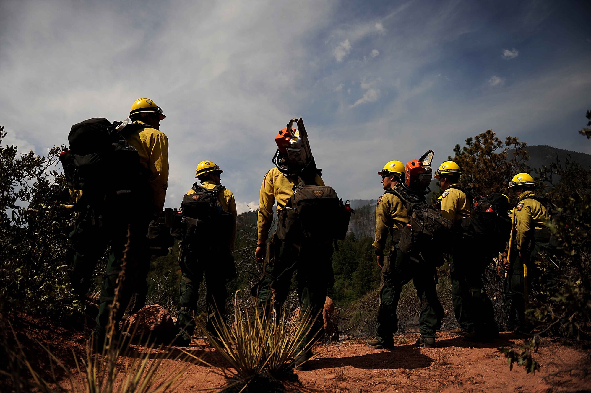 Vandenberg Air Force Base Hot Shot firefighters prepare to cut a fire line in the Mount Saint Francois area of Colorado Springs, Colo., while helping to battle several fires in Waldo Canyon on June 28, 2012.  The Waldo Canyon fire has grown to 18,500 acres and burned more than 300 homes. (U.S. Air Force photo/Master Sgt. Jeremy Lock)