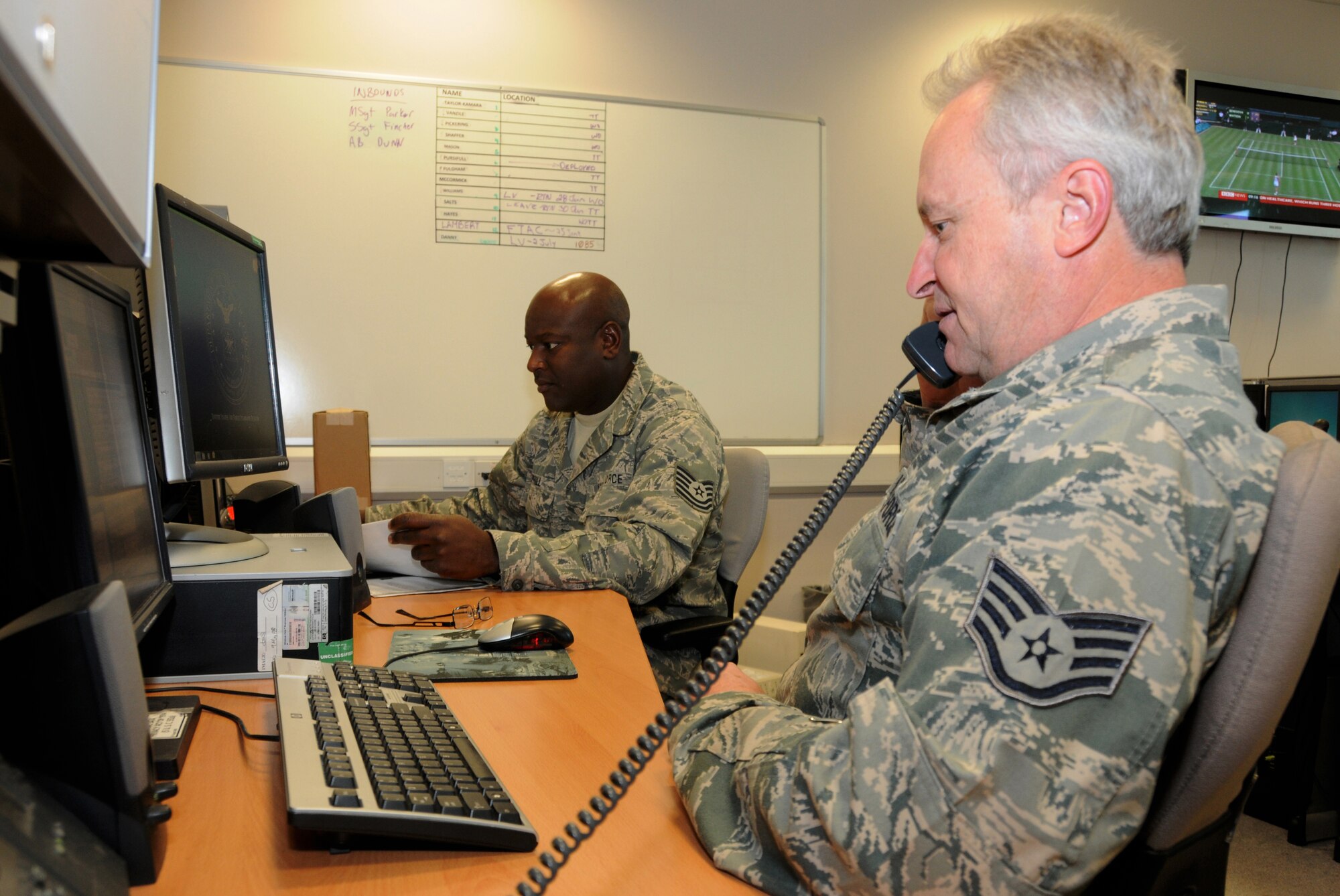 ROYAL AIR FORCE LAKENHEATH, England – Tech. Sgt. David Hemphill (left) and Staff Sgt. Brent Orth, 177th Communications Squadron cyber transport technicians, review telephone communication programs in the 48th CS building June 26, 2012. Airmen from the 117th Air Refueling Wing visited the Liberty Wing for training and a chance to see how the 48th Fighter Wing operates.  (U.S. Air Force photo by Master Sgt. Ken Johnson)