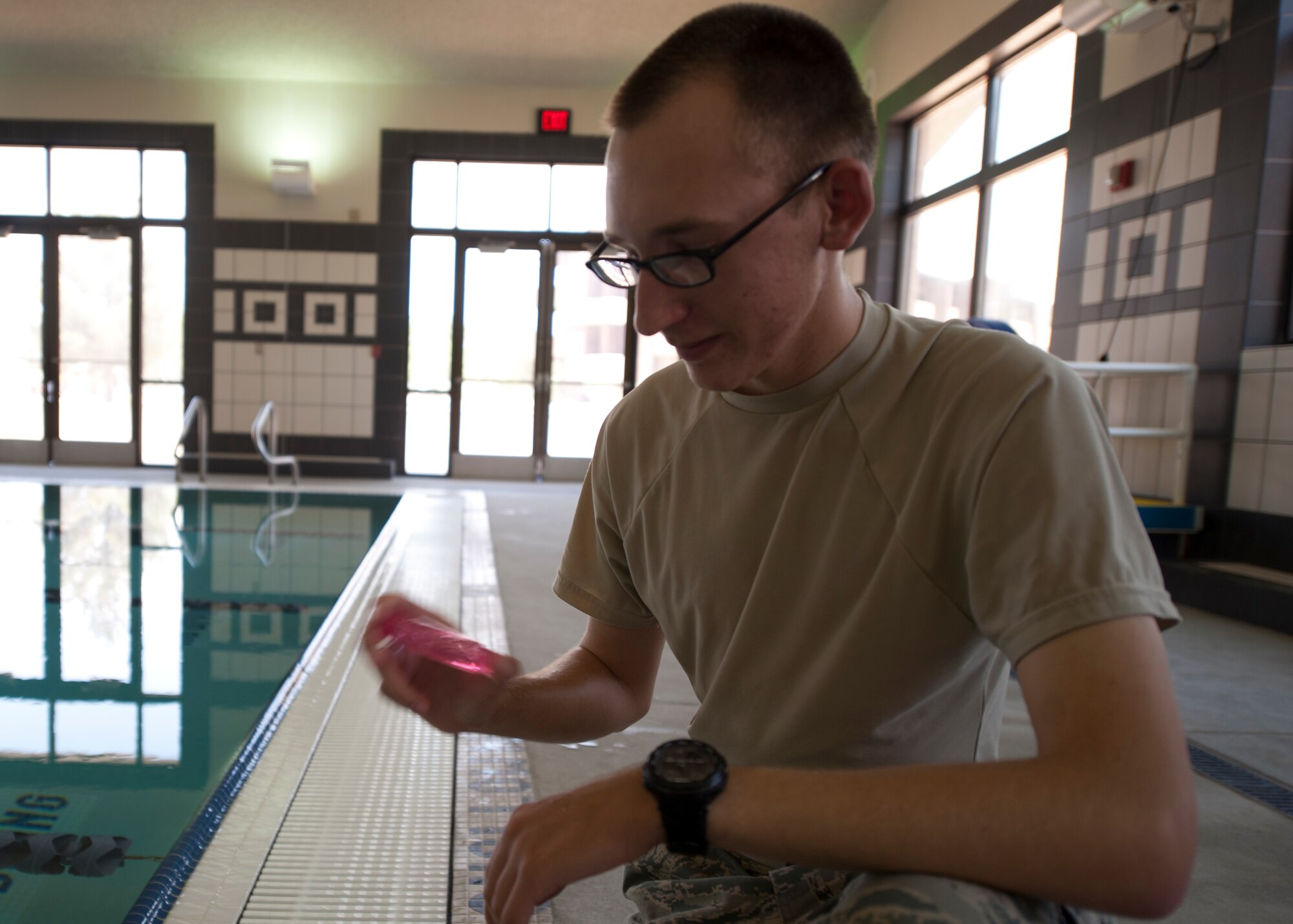 Airman 1st Class Peyton Oesterreich, 49th Aerospace Medicine Squadron bioenvironmental engineer apprentice, mixes a water sample from the Domenici Fitness and Sports Center pool at Holloman Air Force Base, N.M., June 27. The water in the test tube changes colors when test chemicals react to chemicals in the water sample. Oesterreich tests the base pools to ensure they have safe hydrogen and chlorine levels. (U.S. Air Force photo by Airman Leah Ferrante/Released)
