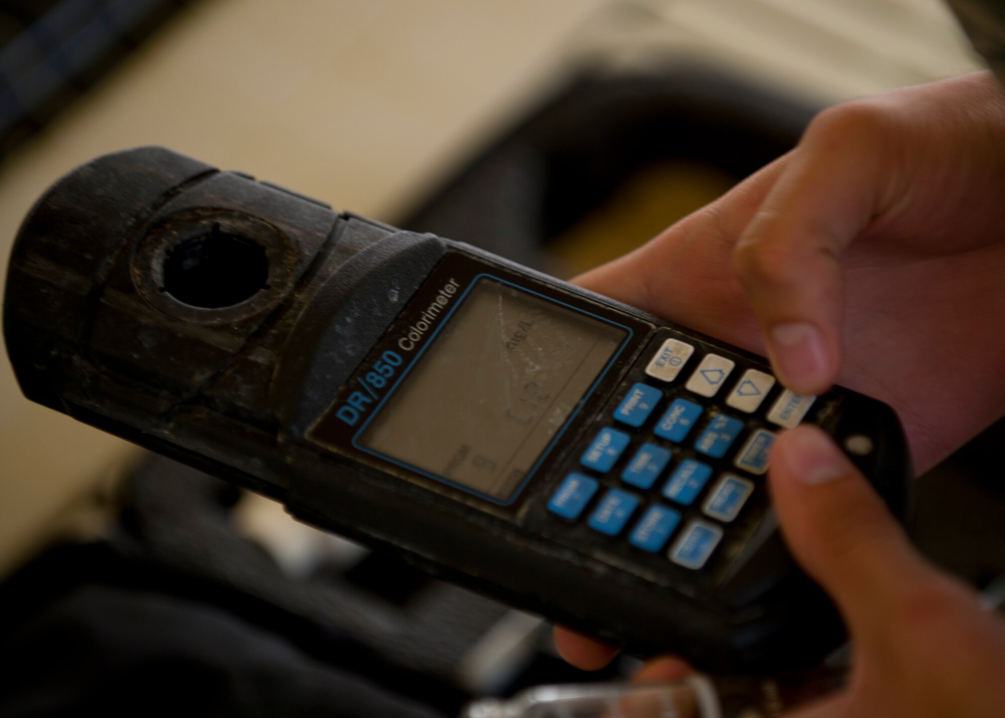 Airman 1st Class Peyton Oesterreich, 49th Aerospace Medicine Squadron bioenvironmental engineer apprentice, prepares a DR/850 colorimeter at the Domenici Fitness and Sports Center pool at Holloman Air Force Base, N.M., June 27. The DR/850 is used to test the chemical levels to determine the water’s quality, by using two filters that use wavelengths to detect the levels in water samples. Oeserreich was testing the base pools to ensure they have safe hydrogen and chlorine levels. (U.S. Air Force photo by Airman Leah Ferrante/Released)