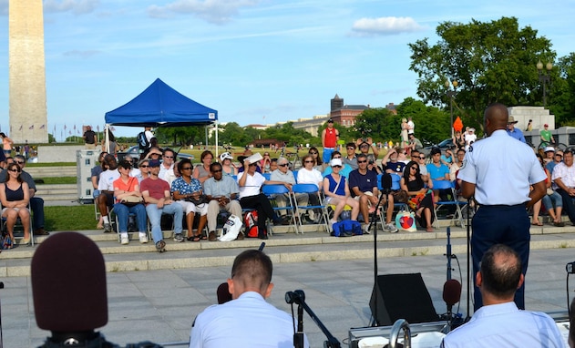 Technical Sgt. Grant Langford solos in front of the Airmen of Note at the World War II Memorial (AF photo by Senior Master Sgt. Kevin Burns)