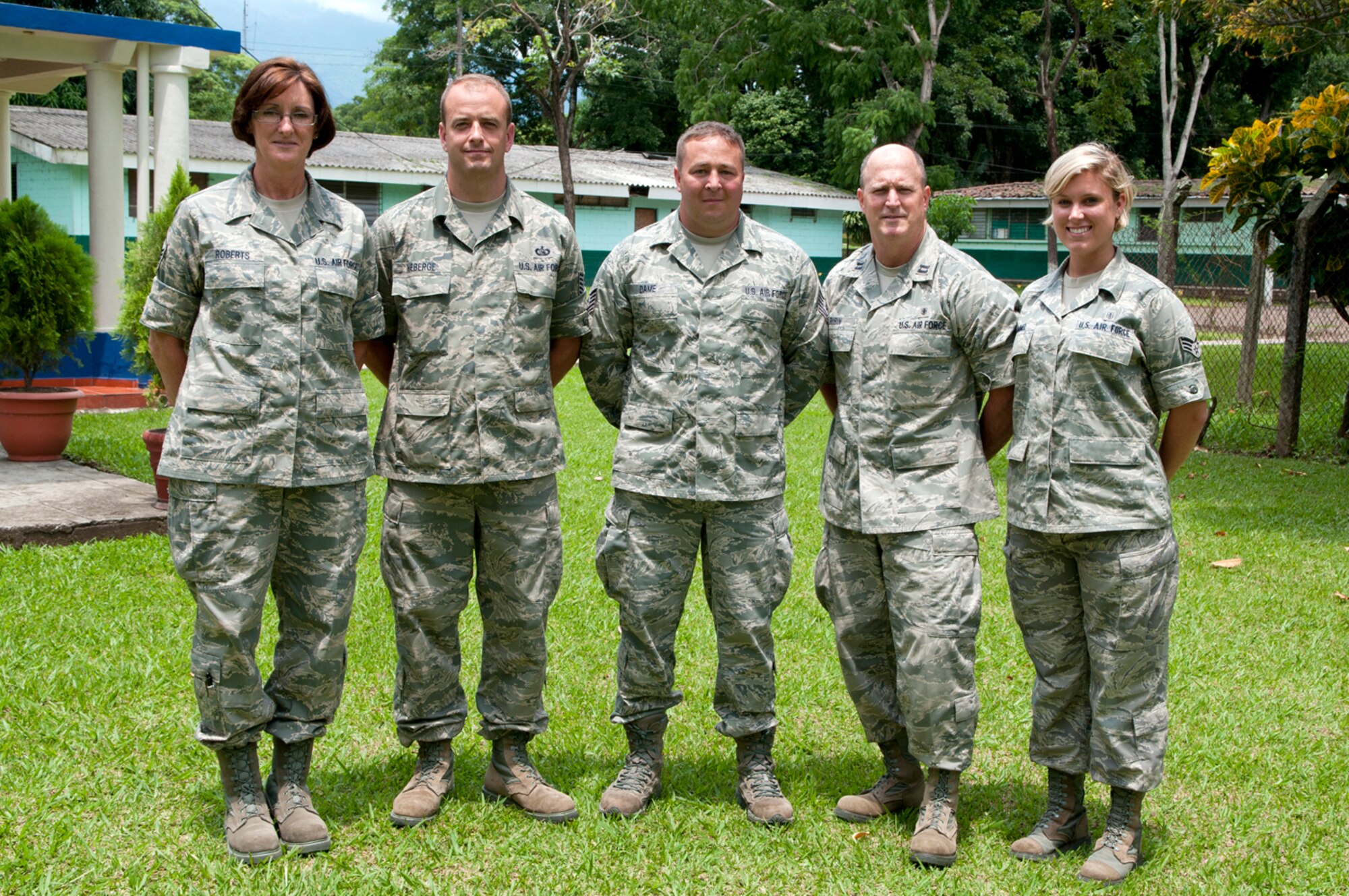 Master Sgt. Sandy Roberts (left), Tech. Sgt. Shawn Theberge, Tech. Sgt. Michael Dame, Capt. Rex Rubin, and Senior Airman Alexa Shimmel, all from the 157th Medical Group New England CERFP team, pose for a group photo outside the training complex on base June 26, 2012. The five medical personnel from the New Hampshire Air National Guard traveled here to participate in a Chemical Biological Radiological Nuclear High Yield Explosive Enhanced Response Force Package (CERFP) exchange with local authorities. (N.H. National Guard photo by Tech. Sgt. Mark Wyatt/RELEASED)