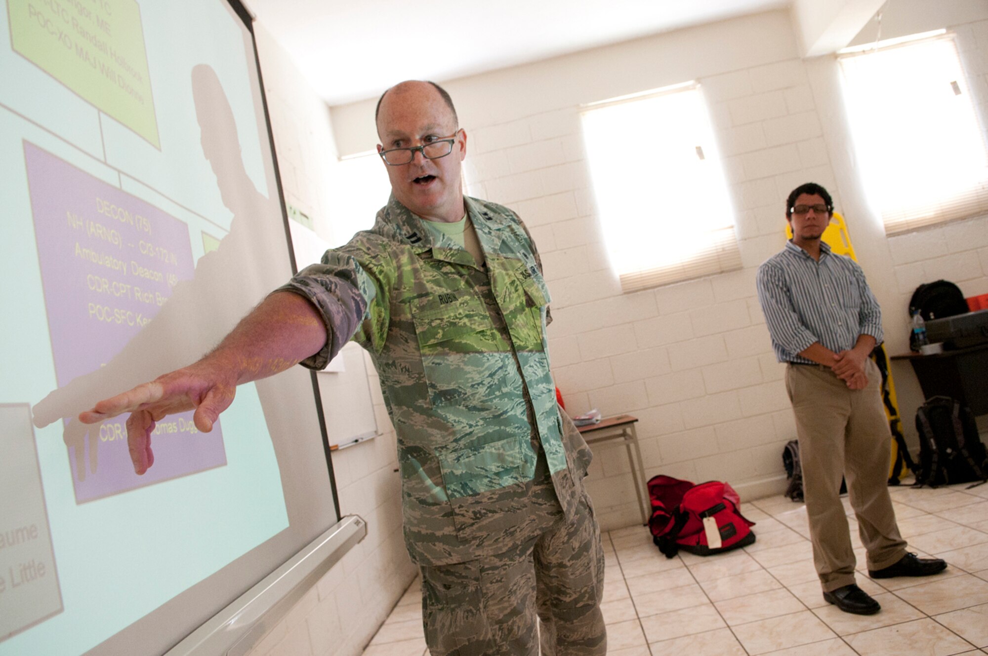 U.S. Air Force Capt. Rex Rubin, a search and extraction operations manager, opens a three-day training exchage with members of the Salvadoran Army and other local civil authorities June 26, 2012. Five medical personnel from the New Hampshire Air National Guard traveled here to participate in a Chemical Biological Radiological Nuclear High Yield Explosive Enhanced Response Force Package (CERFP) exchange with local authorities. (N.H. National Guard photo by Tech. Sgt. Mark Wyatt/RELEASED)