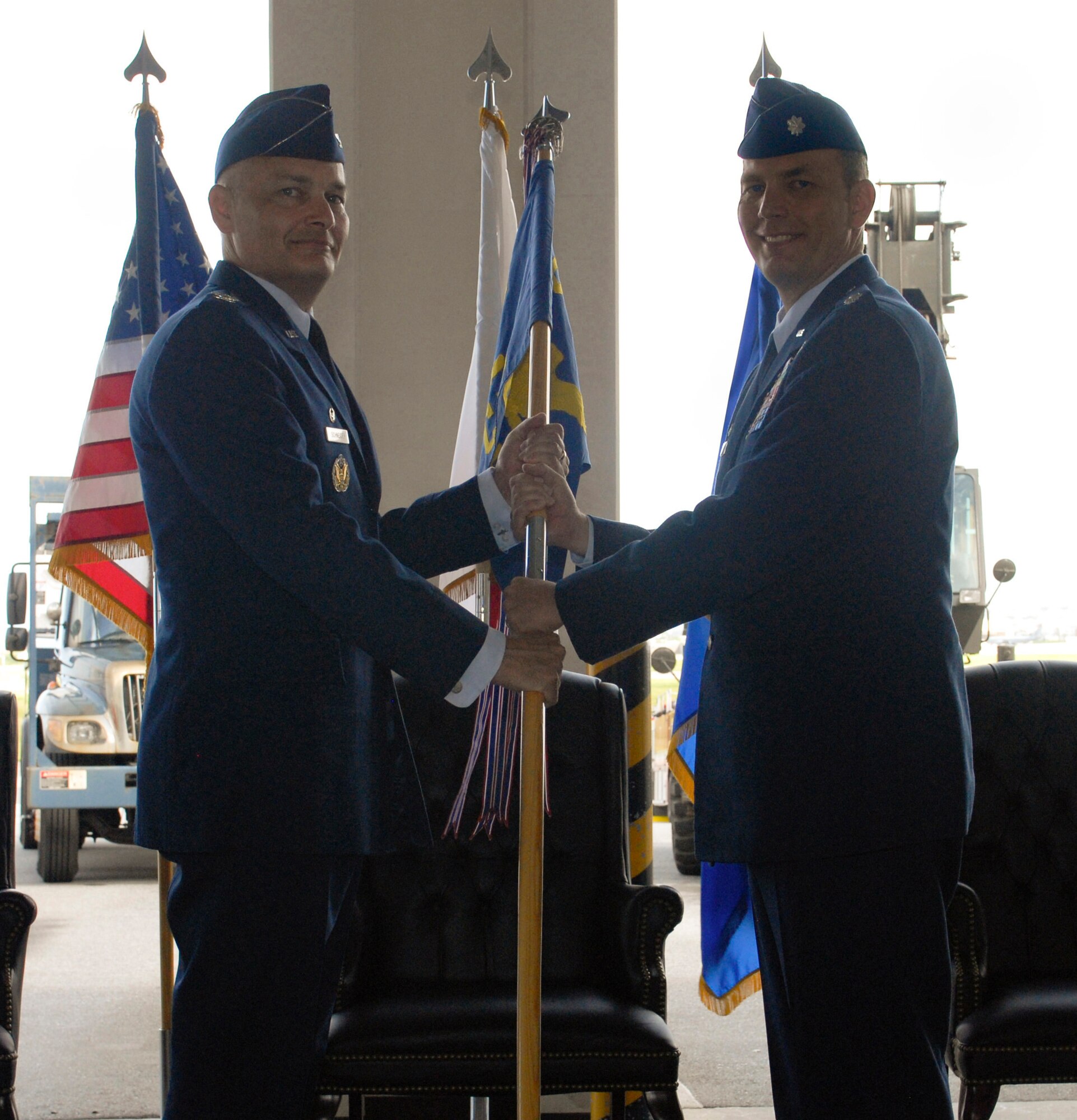 U.S Air Force Lt. Col. Bryan Opperman, 18th Civil Engineer Squadron commander, accepts the 18th Civil Engineer Squadron guidon from Col. Gary Schneider, 18th Civil Engineer Group commander, signifying his acceptance of command on Kadena Air Base, Japan, June 29, 2012. The 18th Civil Engineer Squadron is responsible for the maintenance and repair of over 5,100 facilities and infrastructure systems, contract base services, fire protection, emergency management, and explosive ordnance disposal operations for Kadena and installations across Okinawa. (U.S. photo/Airman 1st Class Malia Jenkins)