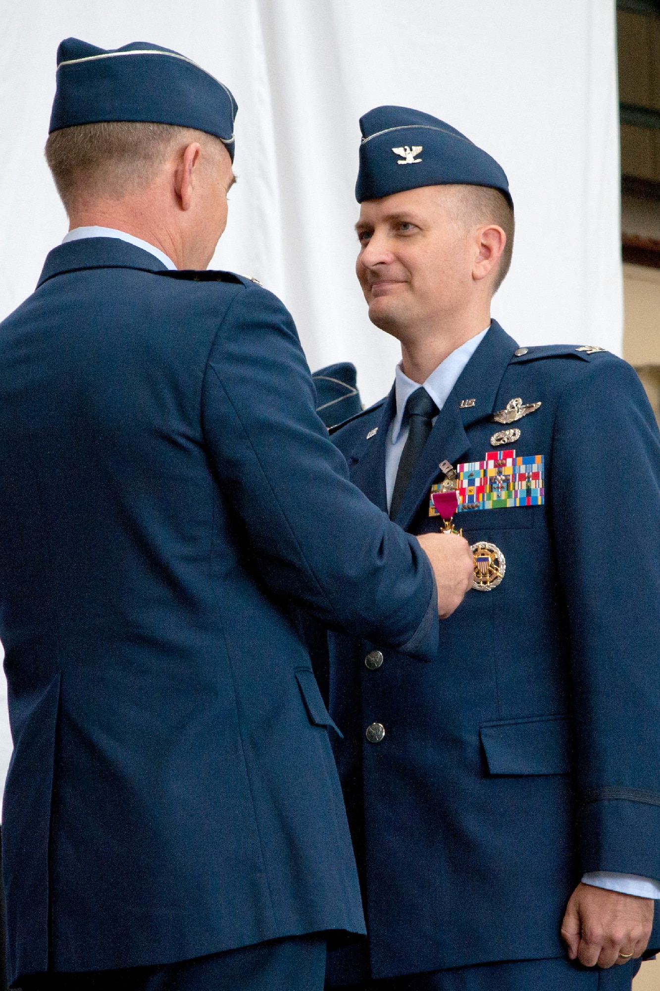 YOKOTA AIR BASE, Japan -- Lt. Gen. Burton Field, 5th Air Force and U.S. Forces, Japan, commander, presented the Legion of Merit decoration to Col. Bill Knight, commander of 374th Airlift Wing during a change of command ceremony June 29, 2012, at Yokota Air Base, Japan.  The decoration is the military's sixth highest and was presented to Knight during the ceremony. (U.S. Air Force photo by Staff Sgt. Shawn Rhodes)