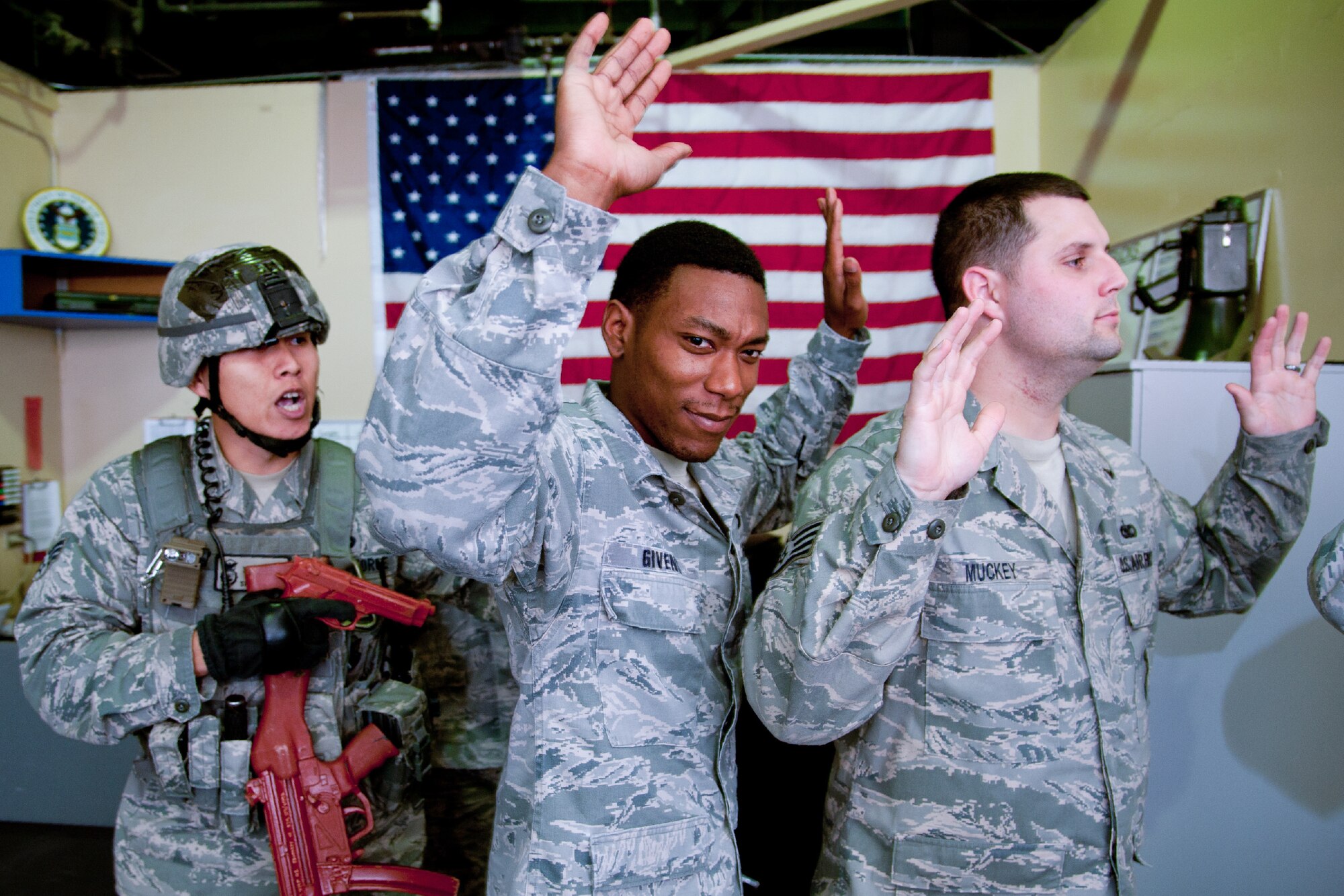 OKOTA AIR BASE, Japan -- Senior Airman Tommy Ngo, left, 374th Security Forces Squadron patrolman, escorts simulated hostile individuals during the First Responders Rodeo at Yokota Air Base, Japan, on June 26, 2012. During the rodeo, Airmen from the 374 SFS, 374th Civil Engineer Squadron fire department and 374th Medical Group refreshed their life-saving skills and strengthened communications between each organization. (U.S. Air Force photo by Staff Sgt. Shawn Rhodes)