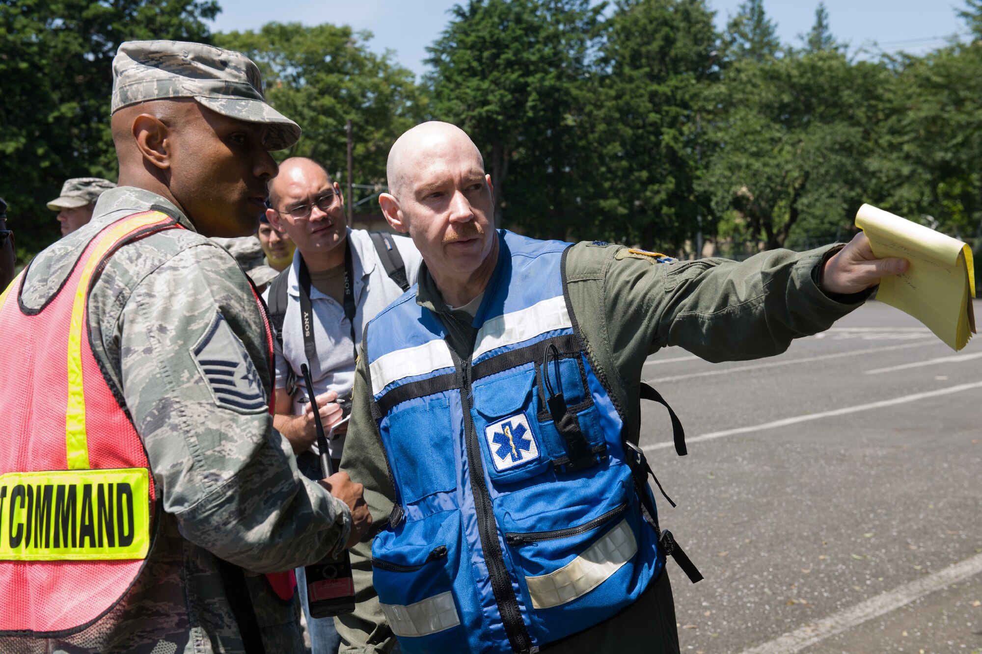 YOKOTA AIR BASE, Japan -- Lt. Col. David Hardy, right, 374th Aerospace Medicine Squadron chief of aerospace medicine, gives information to Master Sgt. Dion Bullock, left, 374th Civil Engineer Squadron assistant fire chief, during the First Responders Rodeo at Yokota Air Base, Japan, on June 26, 2012. Airmen from the 374 SFS, 374th CES fire department and 374th Medical Group refreshed their life-saving skills and strengthened communications between each organization. (U.S. Air Force photo by Osakabe Yasuo)