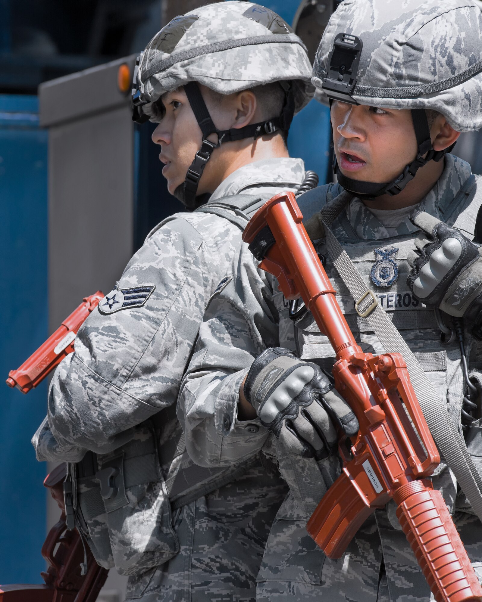 YOKOTA AIR BASE, Japan -- Airman 1st Class Oscar Canteros, right, communicates with patrolmen by radio while Senior Airman Tommy Ngo, 374th SFS patrolman, watches an unfolding training scenario during the First Responders Rodeo at Yokota Air Base, Japan, on June 26, 2012. Both are patrolmen with the 374th Security Forces Squadron. The exercise enabled joint responders to coordinate proper response procedures in a simulated environment. (U.S. Air Force photo by Osakabe Yasuo) 