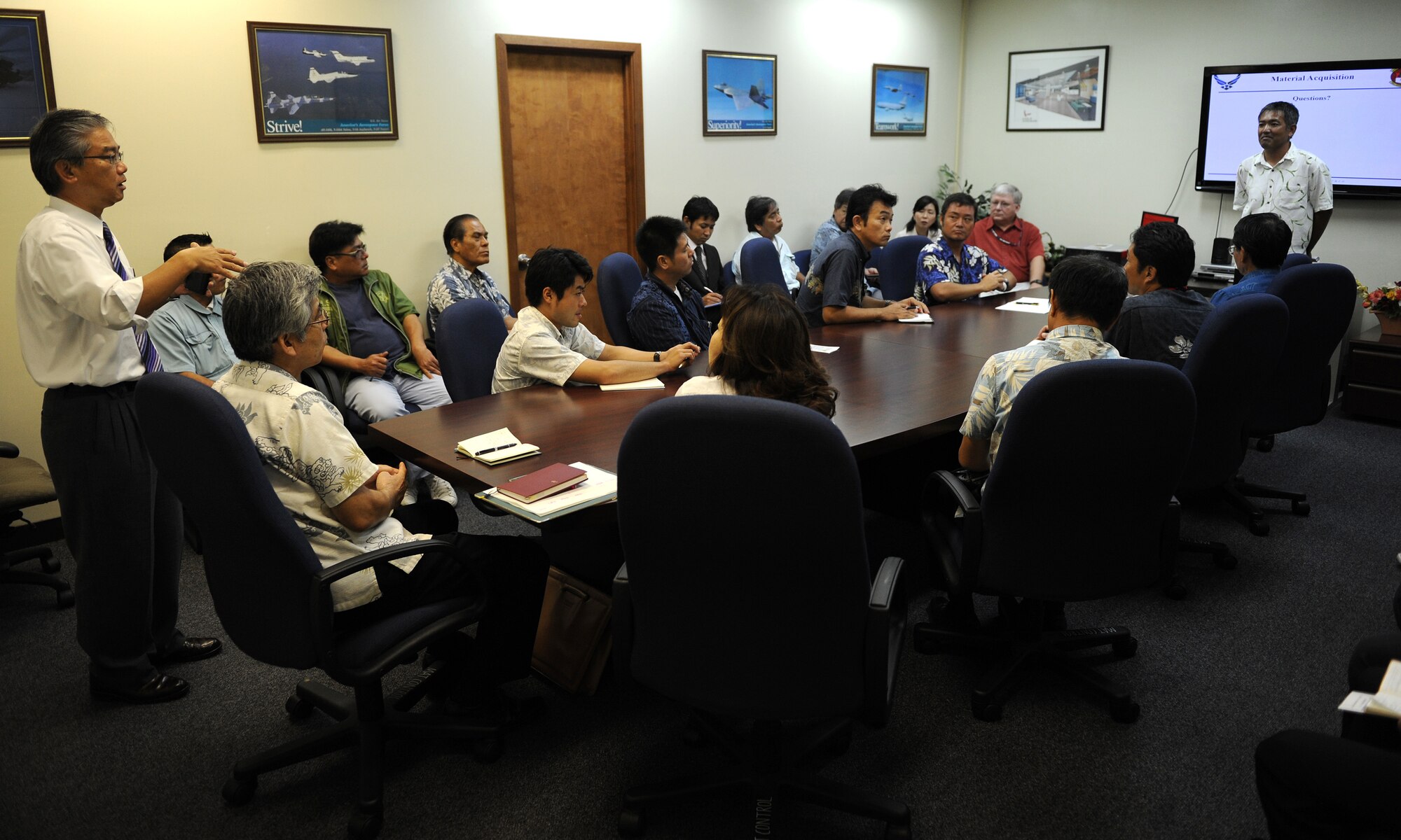 Toshikazu Gima, 18th Civil Engineer Squadron general supply specialist, gives a briefing to the local business leaders during the “Okinawa First” business tour on Kadena Air Base, Japan, June 26, 2012. Eduardo Oyadomari, Assistant Manager from the Small and Medium Enterprises Center’s Management Support Department of the Okinawa Industry Promotion Public Corporation, asked questions regarding the Eagle Hardware warehouse and material holding area during the tour. Local Japanese business leaders had the opportunity to learn the type of materials the U.S. military is looking for during their visit. (U.S. Air Force photo/Junko Kinjo)