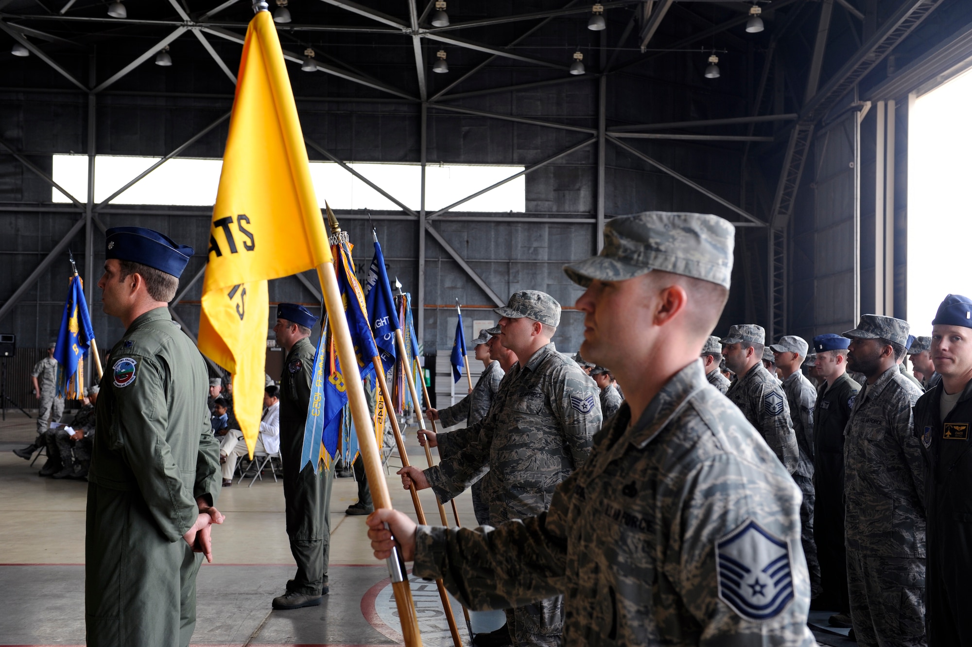 Members of the 8th Operations Group await the beginning of a change of command ceremony June 29, 2012, at Kunsan Air Base, Republic of Korea. Command of the group passed from Col. Craig Leavitt to Col. James Sturgeon. (U.S. Air Force photo/Senior Airman Brigitte N. Brantley)