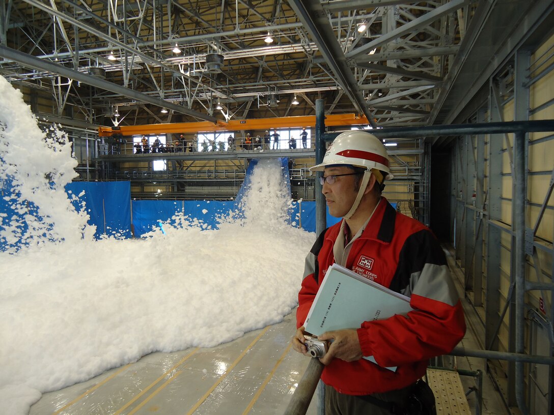 IWAKUNI, Japan--Noriyuki Mizuta, an architectural engineer at the U.S. Army 
Corps of Engineers-Japan District's Iwakuni Office, oversees the aqueous film 
forming foam discharge test for an aircraft and supporting facilities.
The hangar will support Marine Aircraft Group 12 (MAG-12) aircraft which are 
currently assigned to MCAS Iwakuni. This is the first of five hangars which 
will support MAG-12 operations. The Corps' Japan District is facilitating the 
construction of the hangars in support of the U.S. Marine Corps in Japan (Official USACE photo by CPT Alex Glade, released).