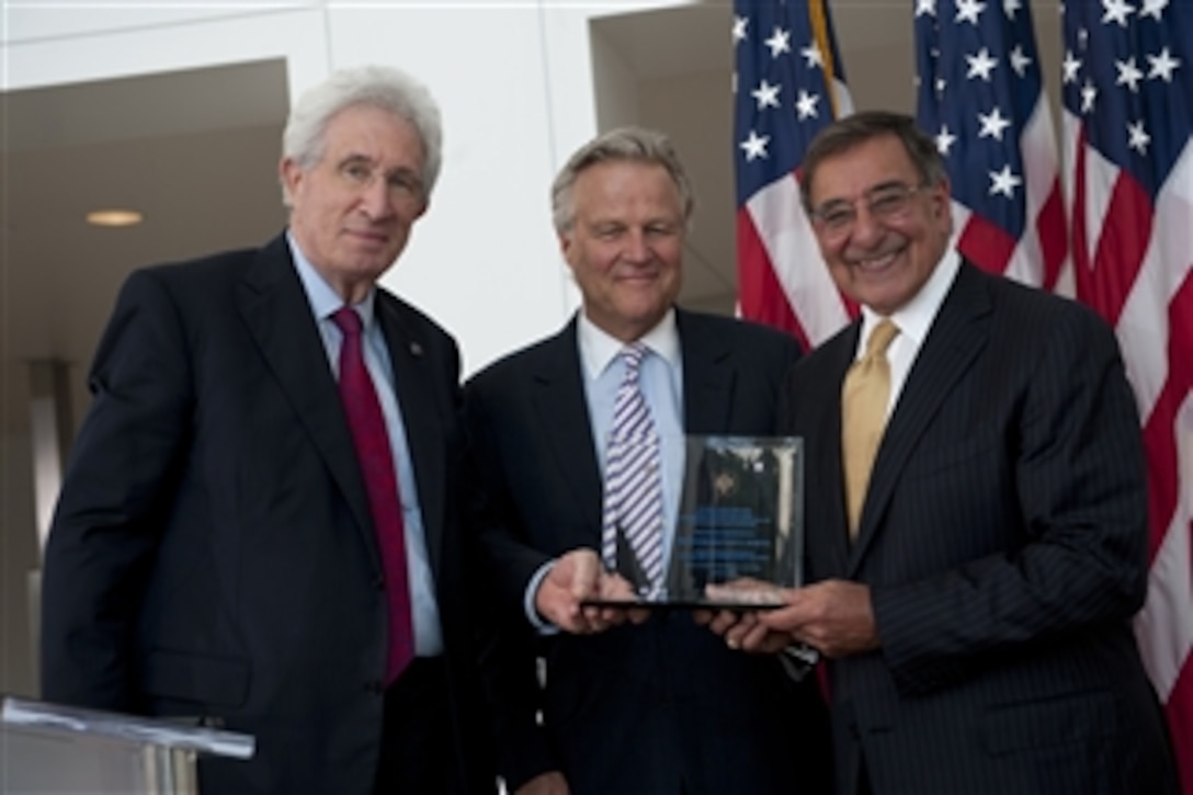 Richard H. Solomon, president, United States Institute of Peace and J. Robinson West, chairman of the Board of Directors, United States Institute of Peace, present Secretary of Defense Leon E. Panetta with the Dean Acheson Award at the Institute in Washington, D.C., June 28, 2012.  Panetta was the keynote speaker at the 5th annual Dean Acheson Lecture to discuss “The Practice of Partnership in the 21st Century”. 