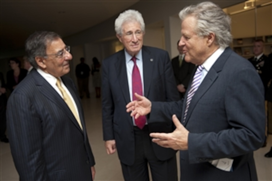Secretary of Defense Leon E. Panetta speaks with Richard H. Solomon, president, United States Institute of Peace, center, and J. Robinson West, chairman of the Board of Directors, United States Institute of Peace, at the Institute in Washington, D.C., June 28, 2012.  Panetta was the keynote speaker at the 5th annual Dean Acheson Lecture to discuss “The Practice of Partnership in the 21st Century”.  