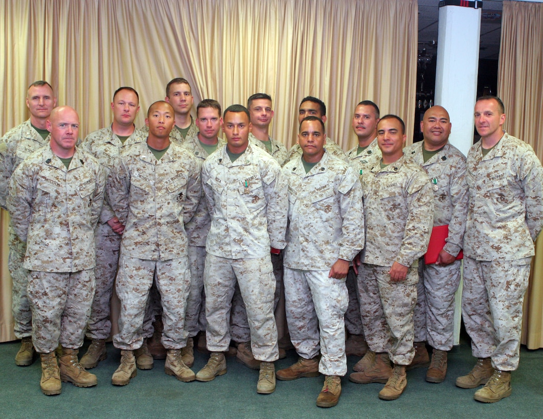 The Marine Corps Security Cooperation Group, or SC Team, stands with Brig. Gen. Charles G. Chiarotti, the deputy commanding general of Marine Forces Africa, Col. Dale S. Vesely, the operations officer, and Sgt. Maj. James J. McCook, the sergeant major for MFA. The Security Cooperation Team consisted of: 1st Lt. Edward A. Agnew, Hospitalman 2nd Class Christopher L. Bermudez, 1st Lt. David L. Dieterich, Staff Sgt. Rafeael D. Encarnacion, Staff Sgt. Timothy C. Lord, Gunnery Sgt. Charley W. Marlar, Staff Sgt. Anthony Peralta, Gunnery Sgt. Flavio W. Riveralopez, Sgt. Paul A. Rosa, Maj. Paul A. Stieglitz, Hospitalman 1st Class Jose T. Ubaldo. U.S. Marine Forces Africa bid farewell to their SC Team Marines and sailors in June as the reservists who make up the detachment return to their respective Home Training Centers in the United States.