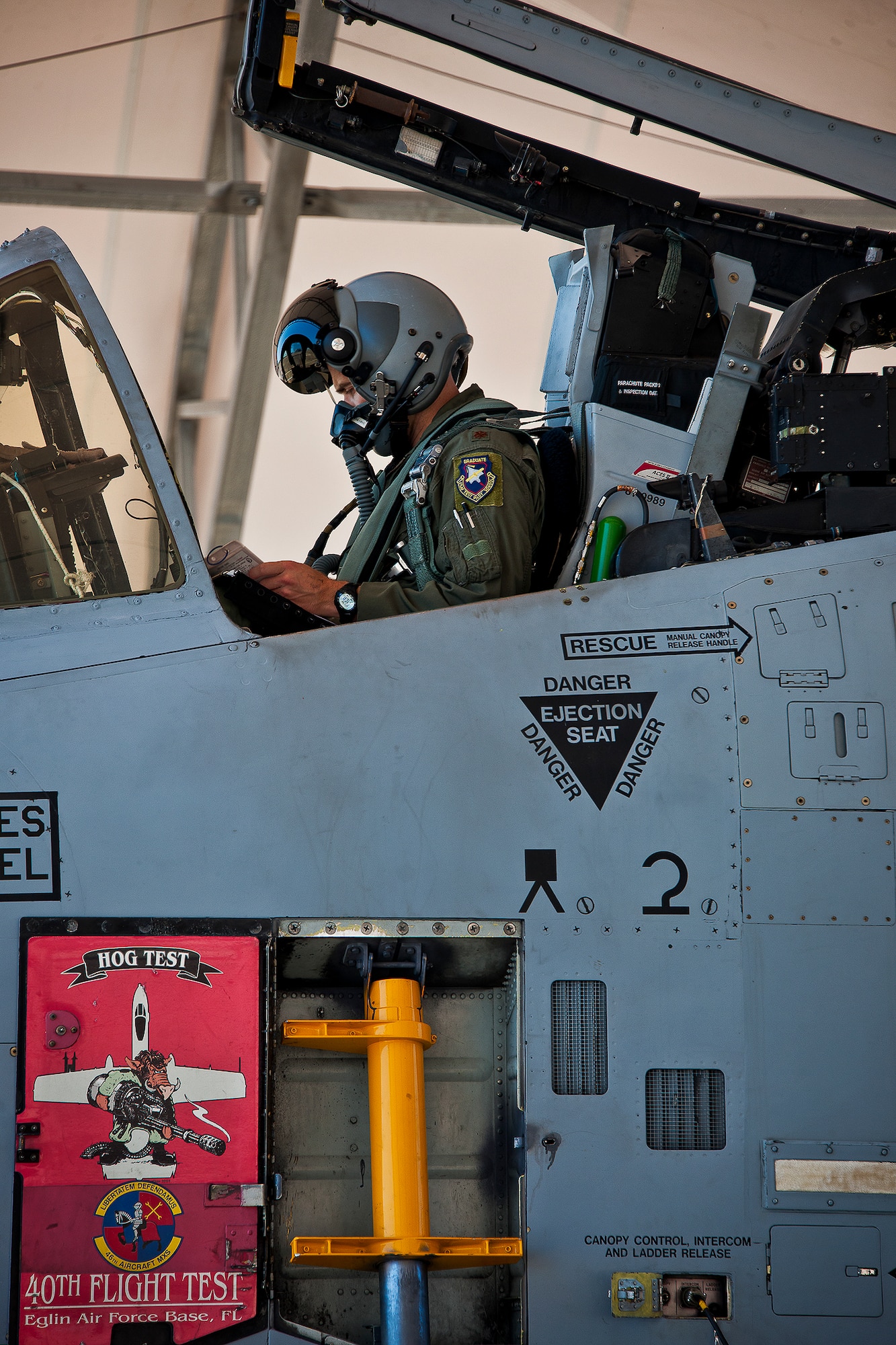 Maj. Travis Burton, an A-10 pilot with the 40th Flight Test Squadron, reviews his checklists before take-off June 28.  Elliot's sortie marked the first flight using an alcohol-derived fuel blend in an A-10 Thunderbolt II.  (U.S. Air Force photo/Samuel King Jr.)
